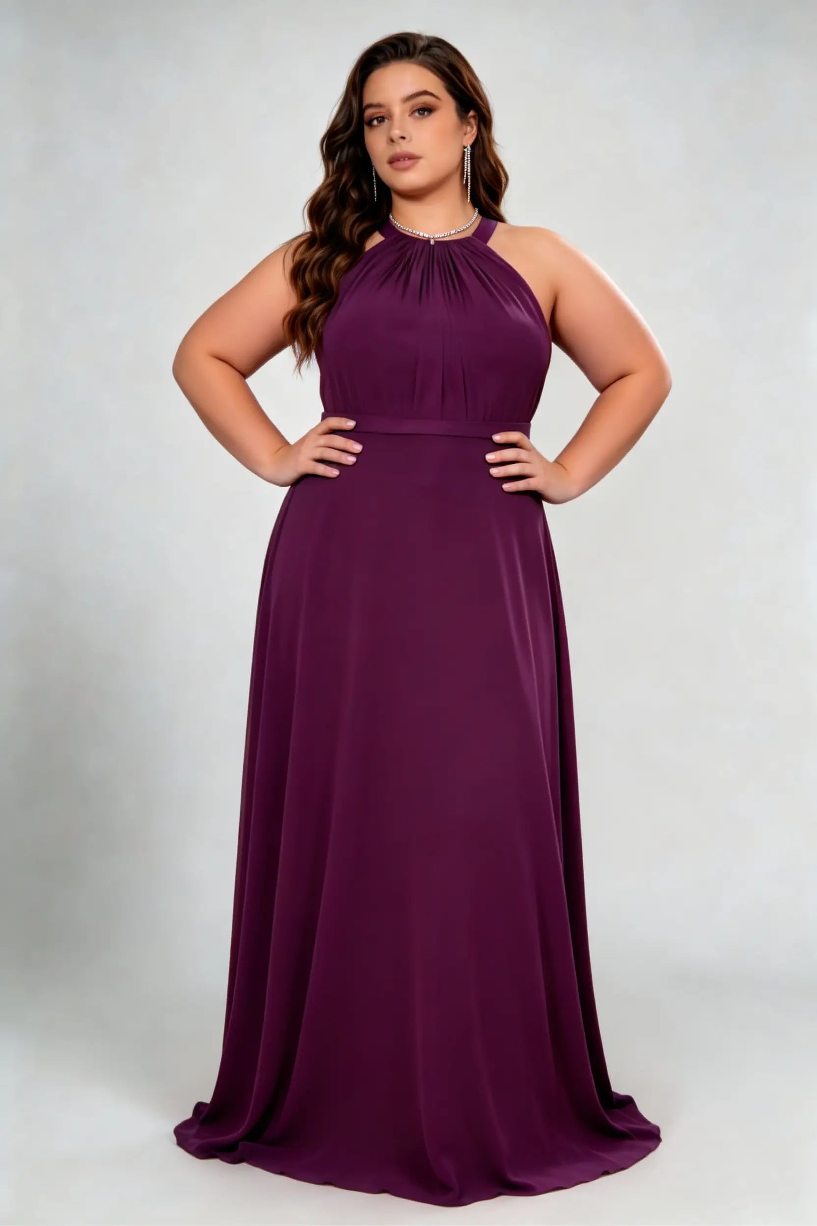 Curvy model wearing plus size burgundy dark plum halter neck evening gown – elegant pleated chiffon a-line formal maxi dress