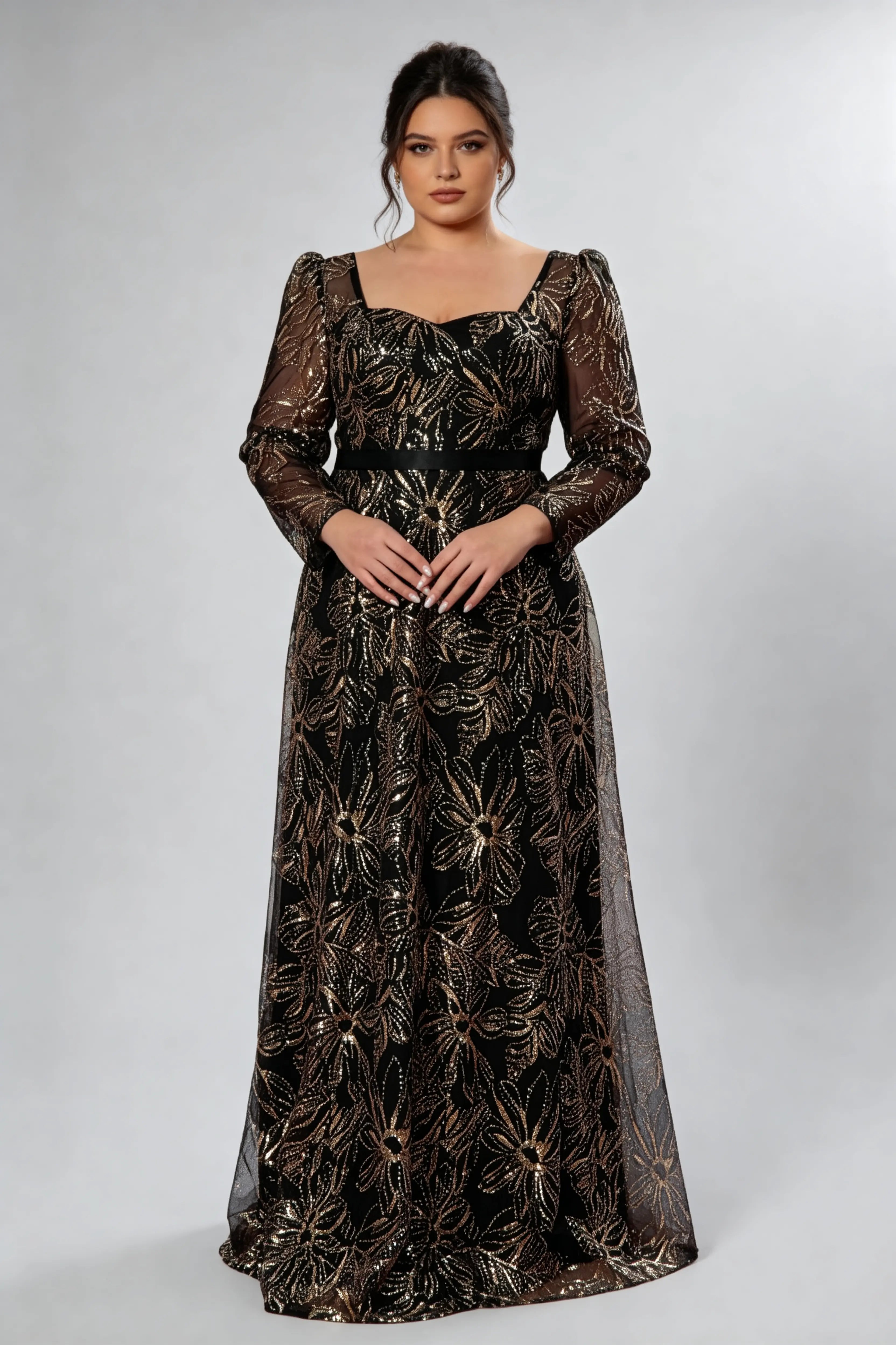 Curvy model wearing plus size black gold sequin floral evening gown - elegant square neck long sleeve a-line maxi prom dress
