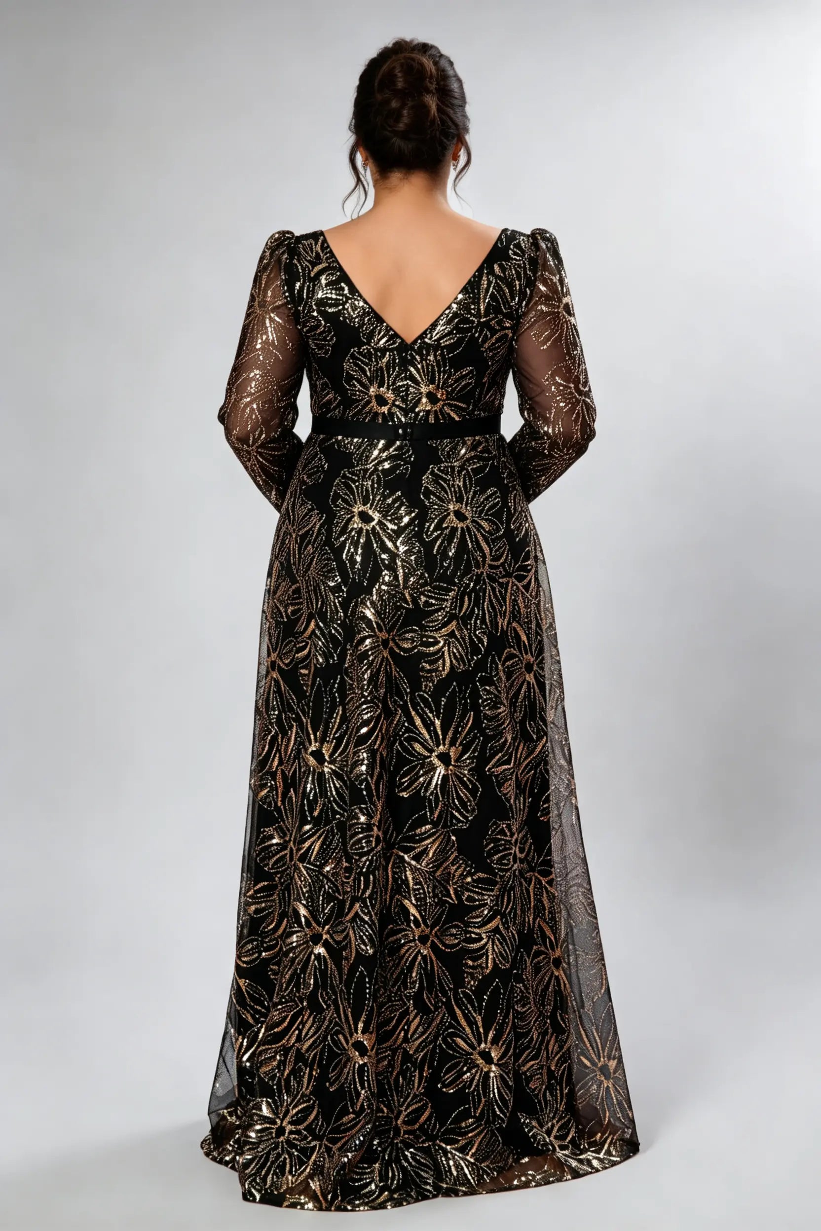 Curvy model wearing plus size black gold sequin floral evening gown - elegant square neck long sleeve a-line maxi prom dress