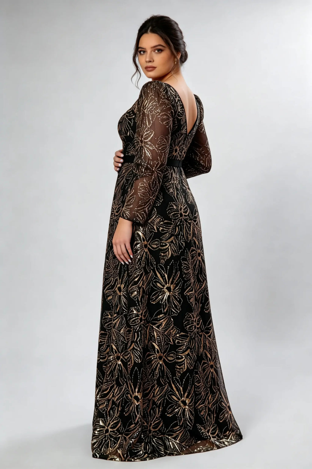 Curvy model wearing plus size black gold sequin floral evening gown - elegant square neck long sleeve a-line maxi prom dress