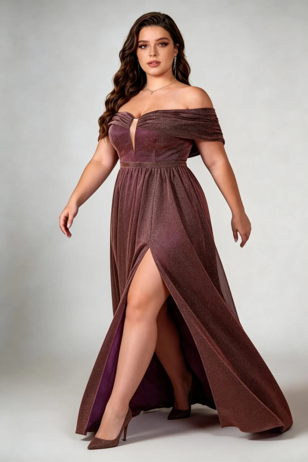 Curvy model wearing plus size brown shimmering off-the-shoulder evening gown – elegant metallic v-neck high slit formal maxi dress