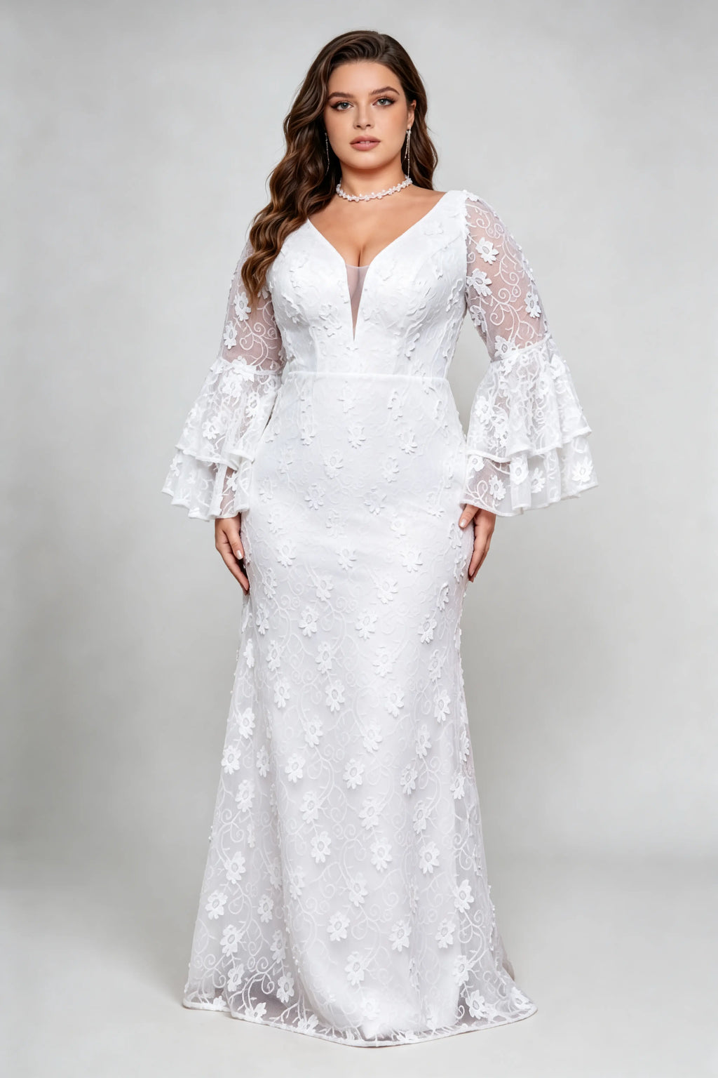 Curvy model wearing plus size v-neck white floral lace maxi dress with tiered bell sleeves