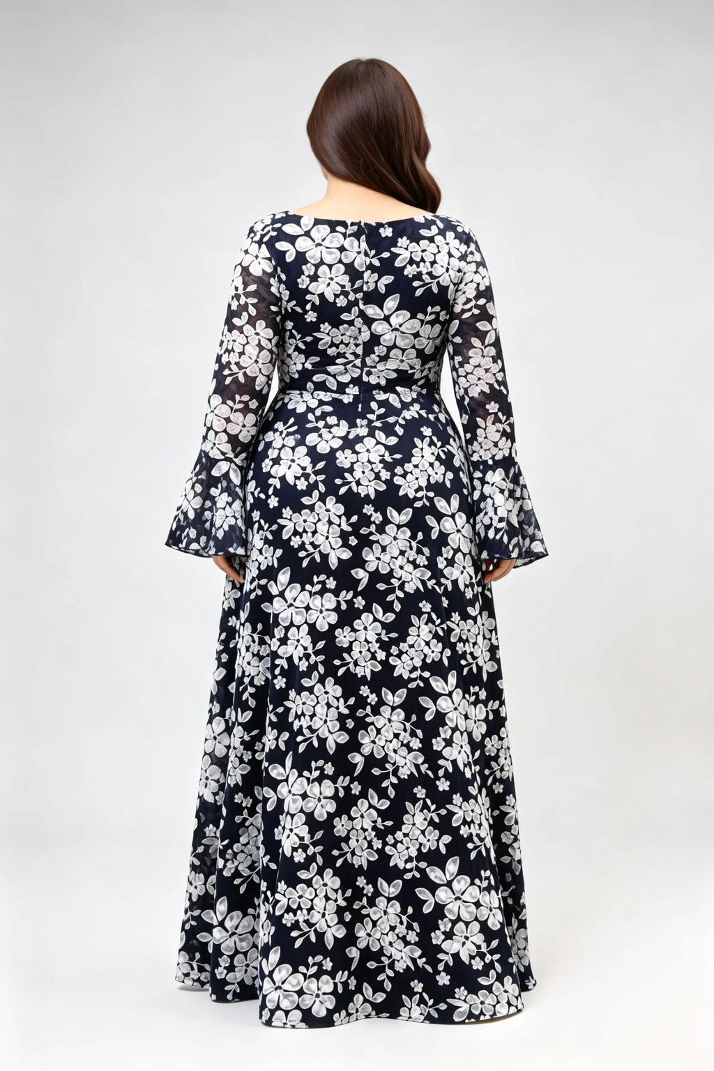 Curvy model wearing plus size navy blue lace floral evening gown - elegant deep v-neck long bell sleeve a-line maxi dress
