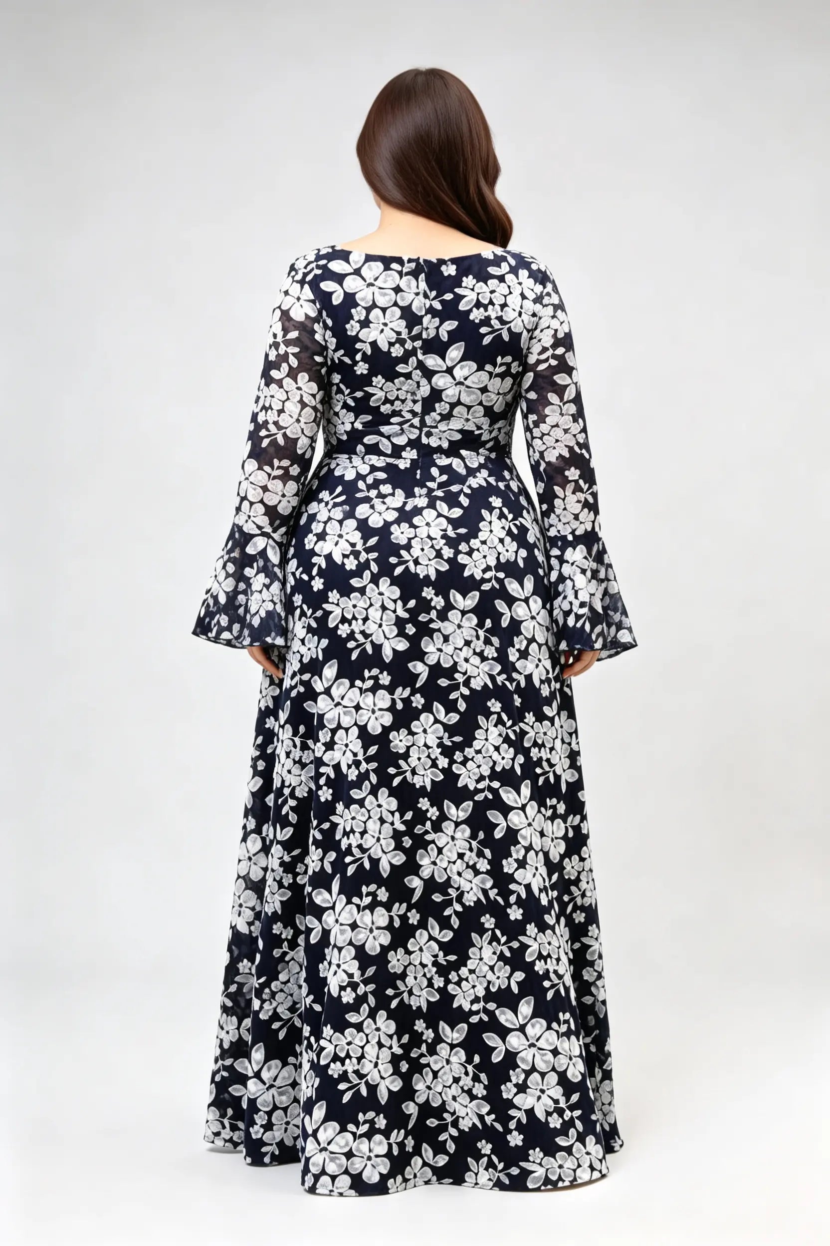 Curvy model wearing plus size navy blue lace floral evening gown - elegant deep v-neck long bell sleeve a-line maxi dress