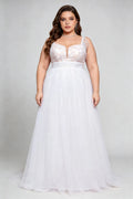 Curvy model wearing plus size white v-neck tulle bridal gown with rhinestone fringe shoulder straps