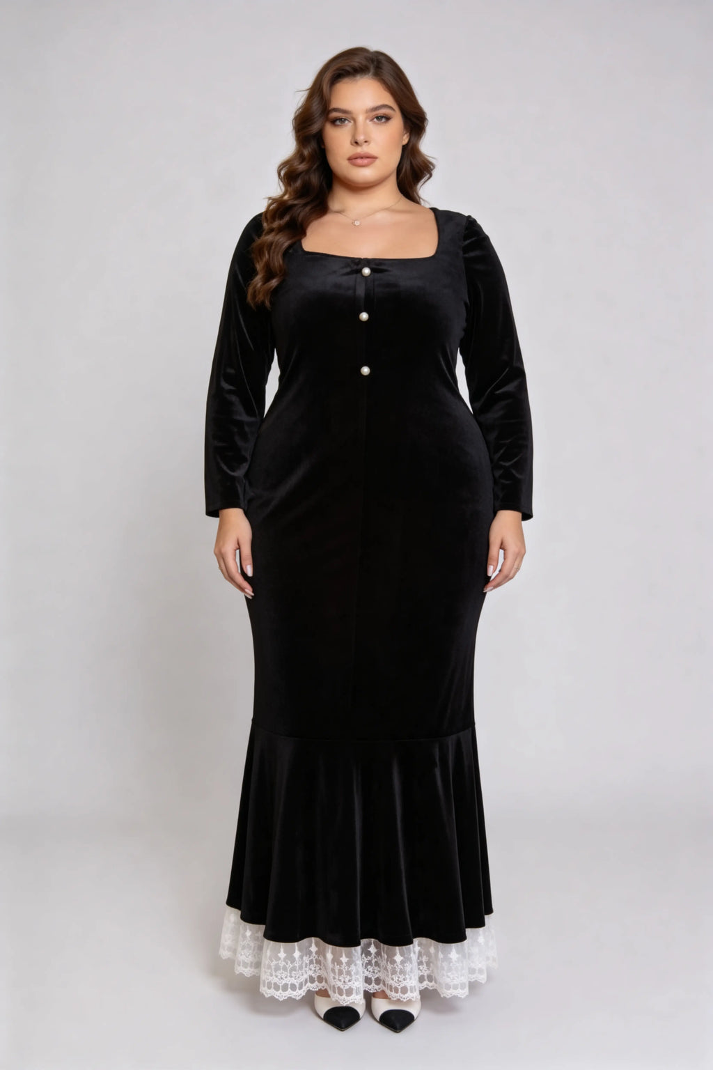 Curvy model wearing plus size black square neck velvet mermaid dress with lace trim hem