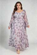 Curvy model wearing plus size cream v-neck long sleeves romantic purple floral ruffle maxi dress