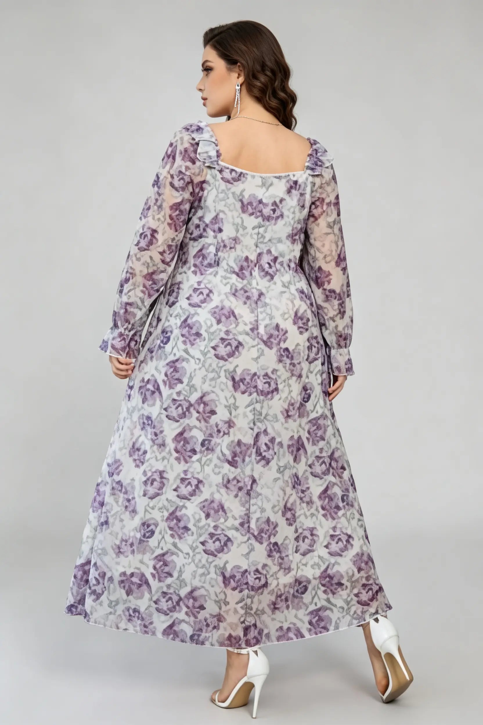 Curvy model wearing plus size cream v-neck long sleeves romantic purple floral ruffle maxi dress