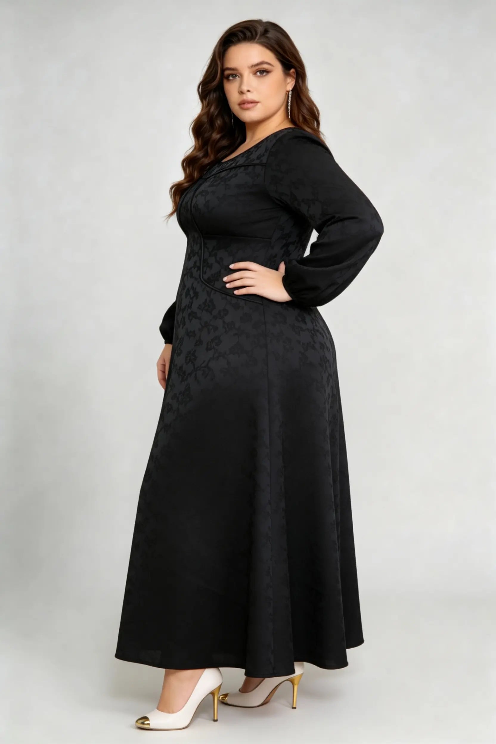 Curvy model wearing plus size luxury black jacquard structured a-line maxi dress