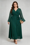 Curvy model wearing phoehua plus size olive-green emerald green faux-wrap sheer dot sleeve maxi dress