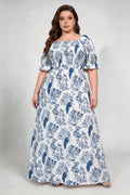 Curvy model wearing plus size blue white floral square neck maxi dress, smocked bodice puff sleeve a‑line flowy elegant casual summer dress