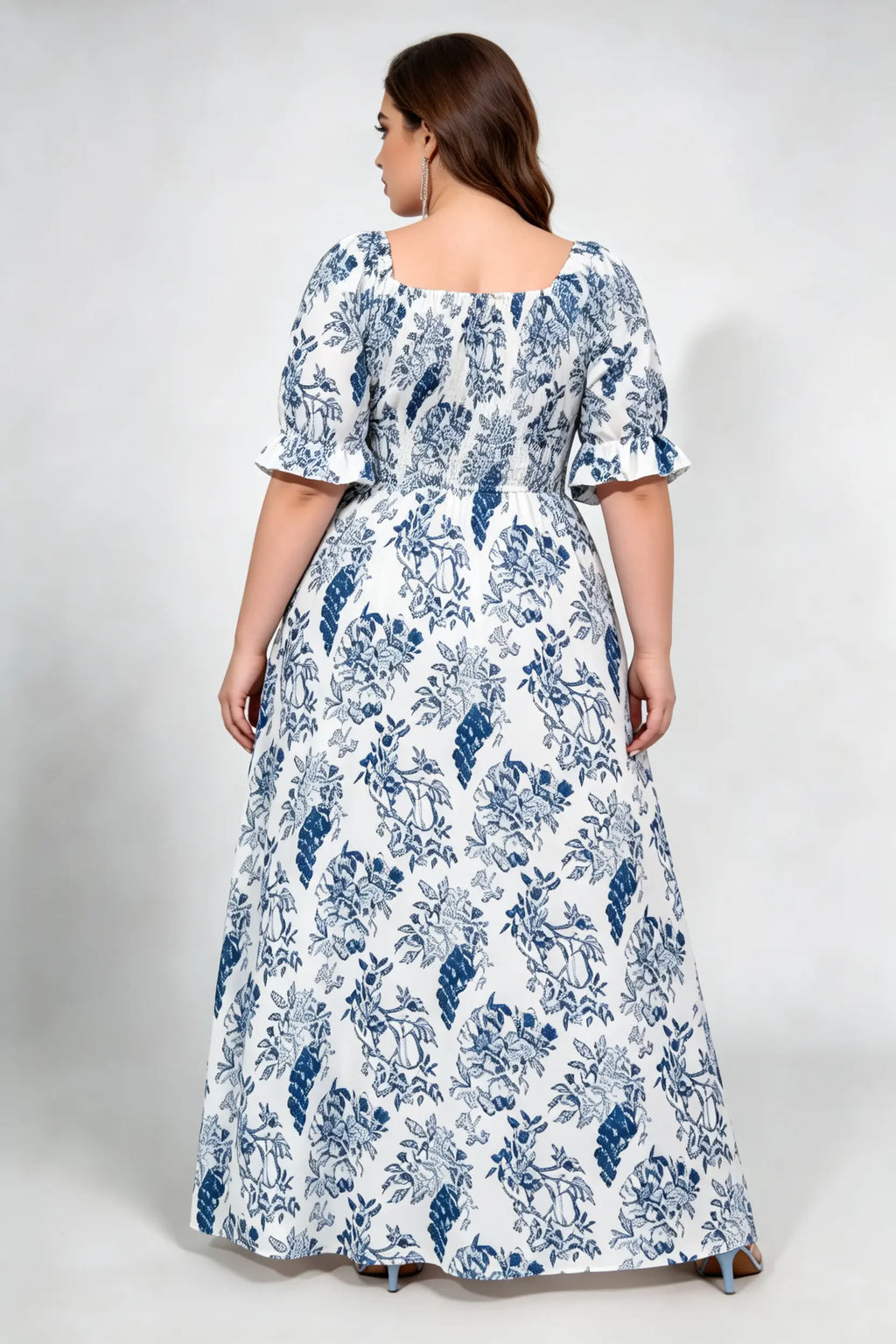 Curvy model wearing plus size blue white floral square neck maxi dress, smocked bodice puff sleeve a‑line flowy elegant casual summer dress