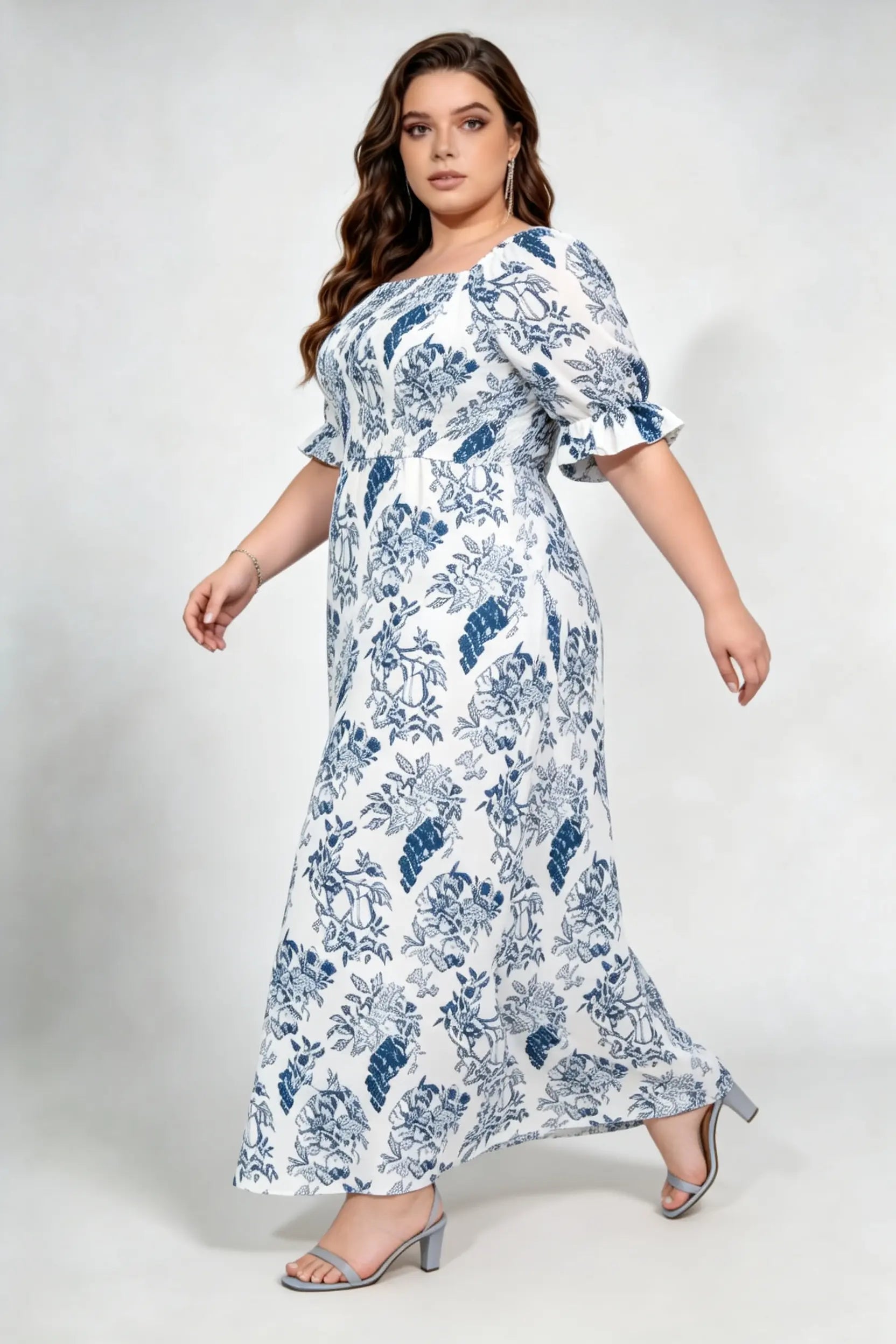 Curvy model wearing plus size blue white floral square neck maxi dress, smocked bodice puff sleeve a‑line flowy elegant casual summer dress