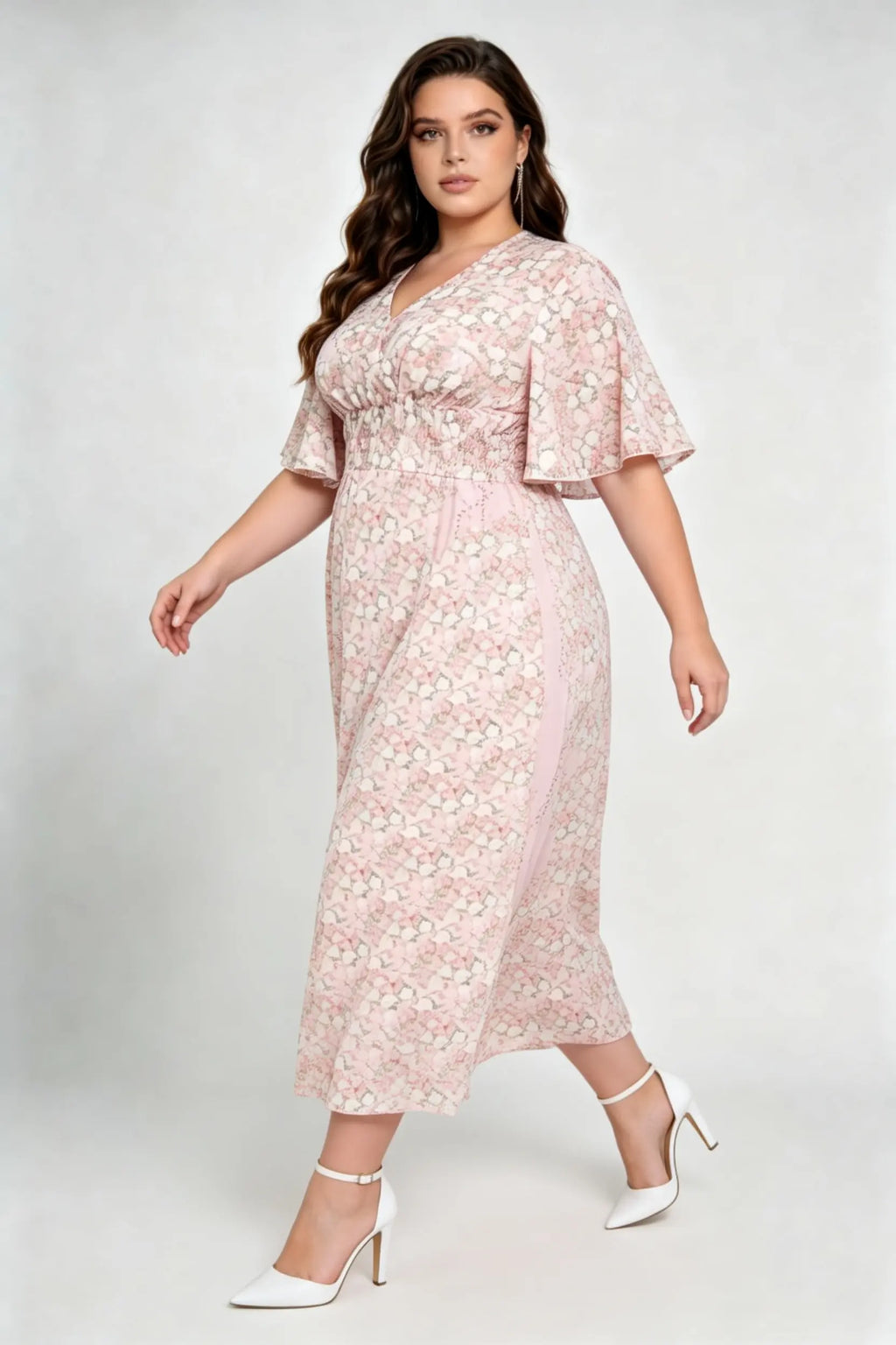 Curvy model wearing plus size pink floral v-neck midi dress, smocked waist flounce sleeve a-line chiffon casual summer dress