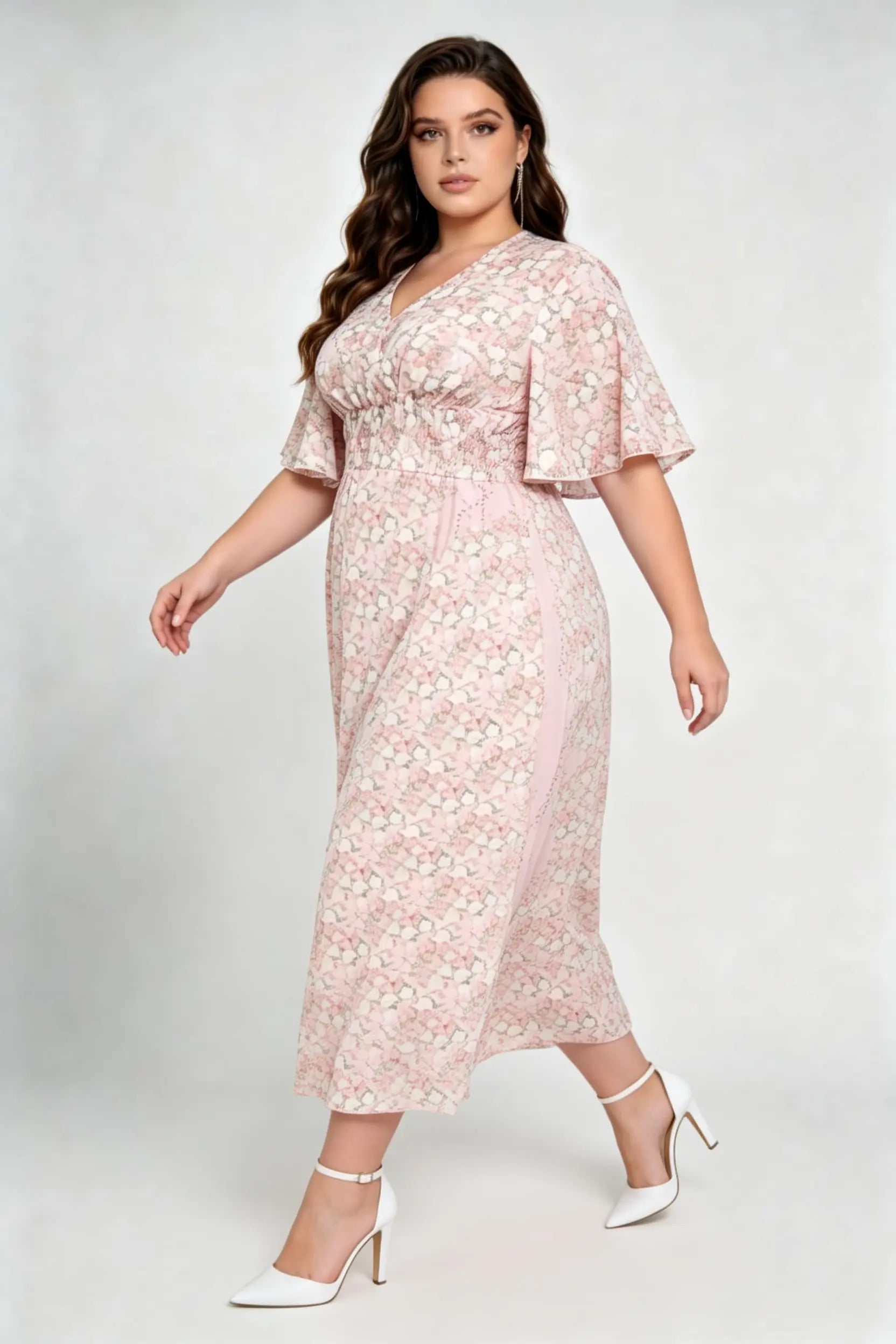 Curvy model wearing plus size pink floral v-neck midi dress, smocked waist flounce sleeve a-line chiffon casual summer dress