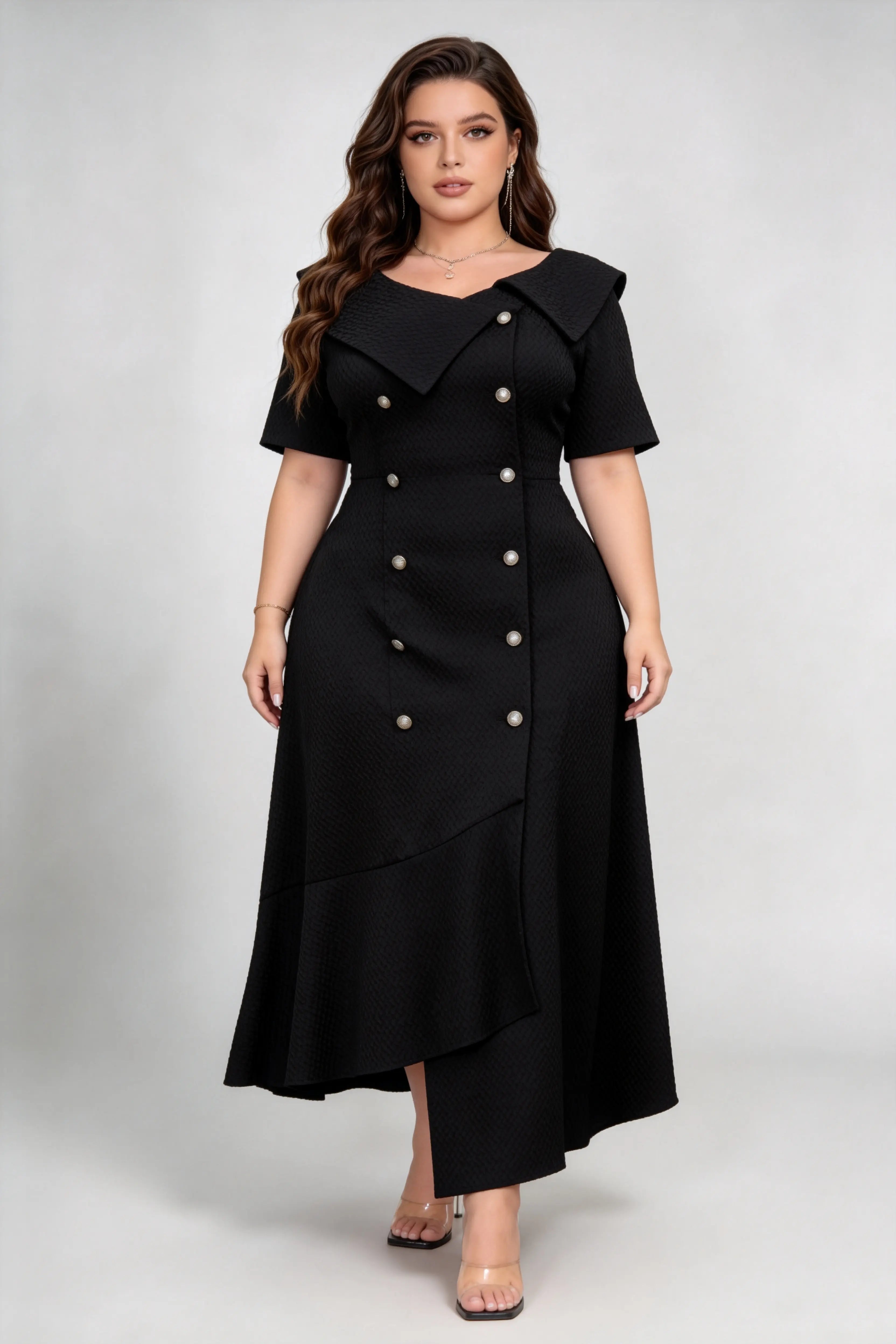Curvy model wearing plus size black double-breasted asymmetric hem maxi dress, notched lapel short sleeve textured elegant workwear spring dress