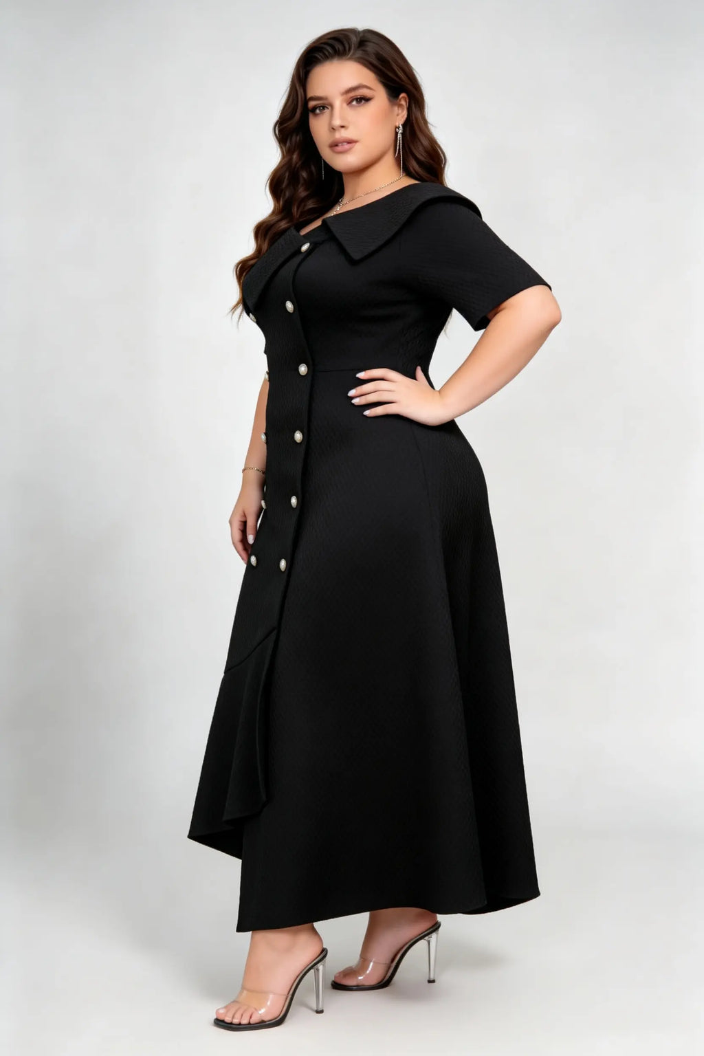 Curvy model wearing plus size black double-breasted asymmetric hem maxi dress, notched lapel short sleeve textured elegant workwear spring dress