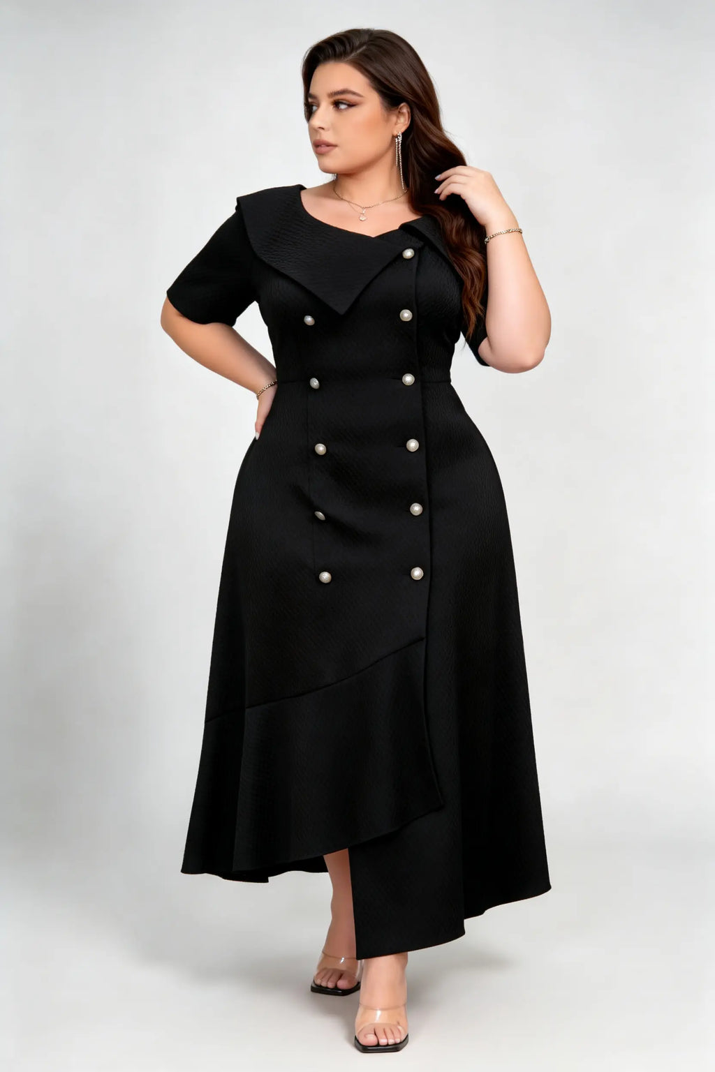 Curvy model wearing plus size black double-breasted asymmetric hem maxi dress, notched lapel short sleeve textured elegant workwear spring dress
