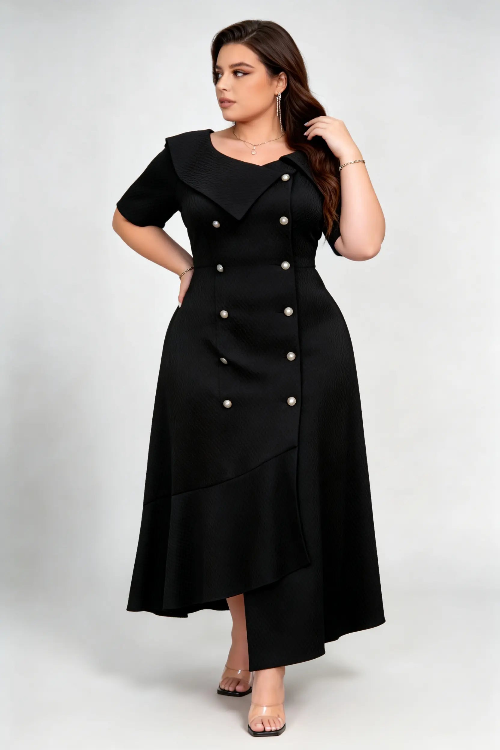 Curvy model wearing plus size black double-breasted asymmetric hem maxi dress, notched lapel short sleeve textured elegant workwear spring dress