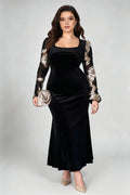 Curvy model wearing plus size black velvet mermaid maxi dress, square neck sheer bell sleeve with gold floral embroidery formal evening dress