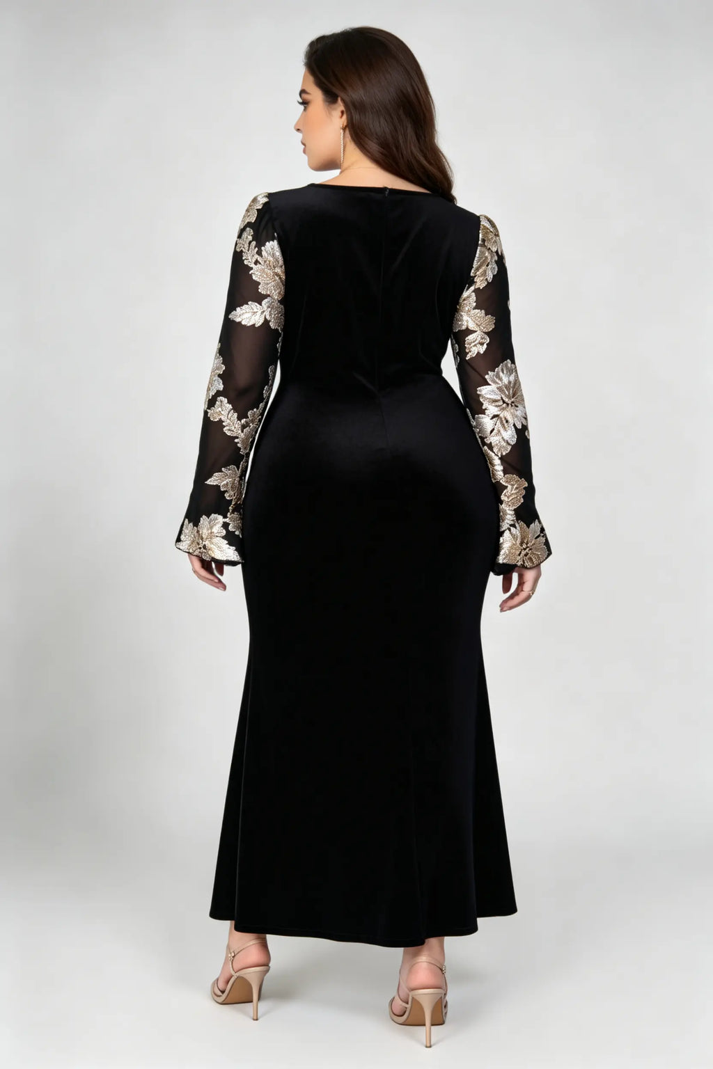 Curvy model wearing plus size black velvet mermaid maxi dress, square neck sheer bell sleeve with gold floral embroidery formal evening dress