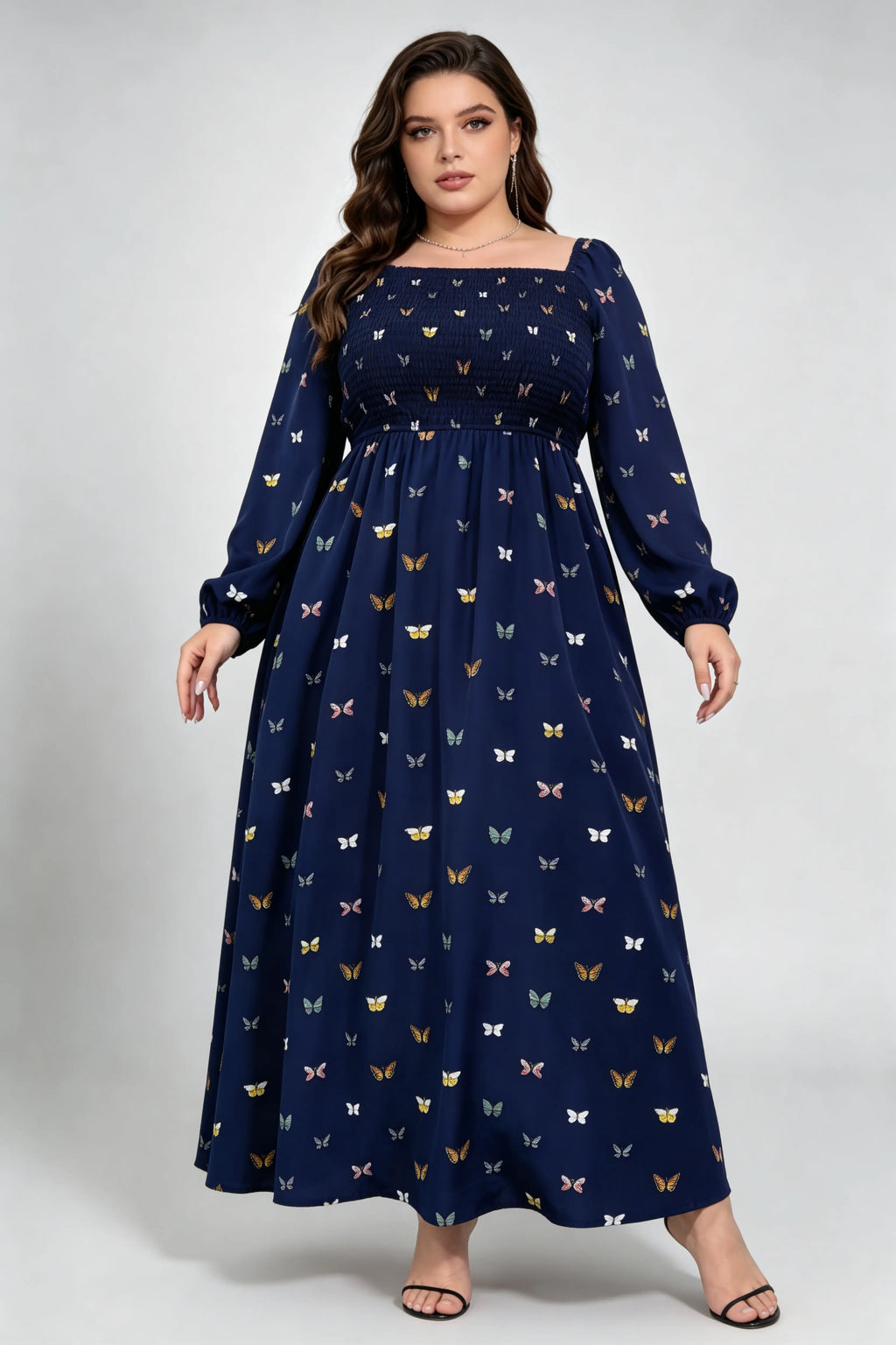 Curvy model wearing plus size navy blue butterfly print maxi dress, square neck smocked long sleeve a-line casual dress