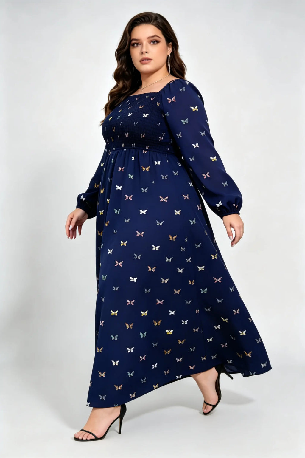 Curvy model wearing plus size navy blue butterfly print maxi dress, square neck smocked long sleeve a-line casual dress
