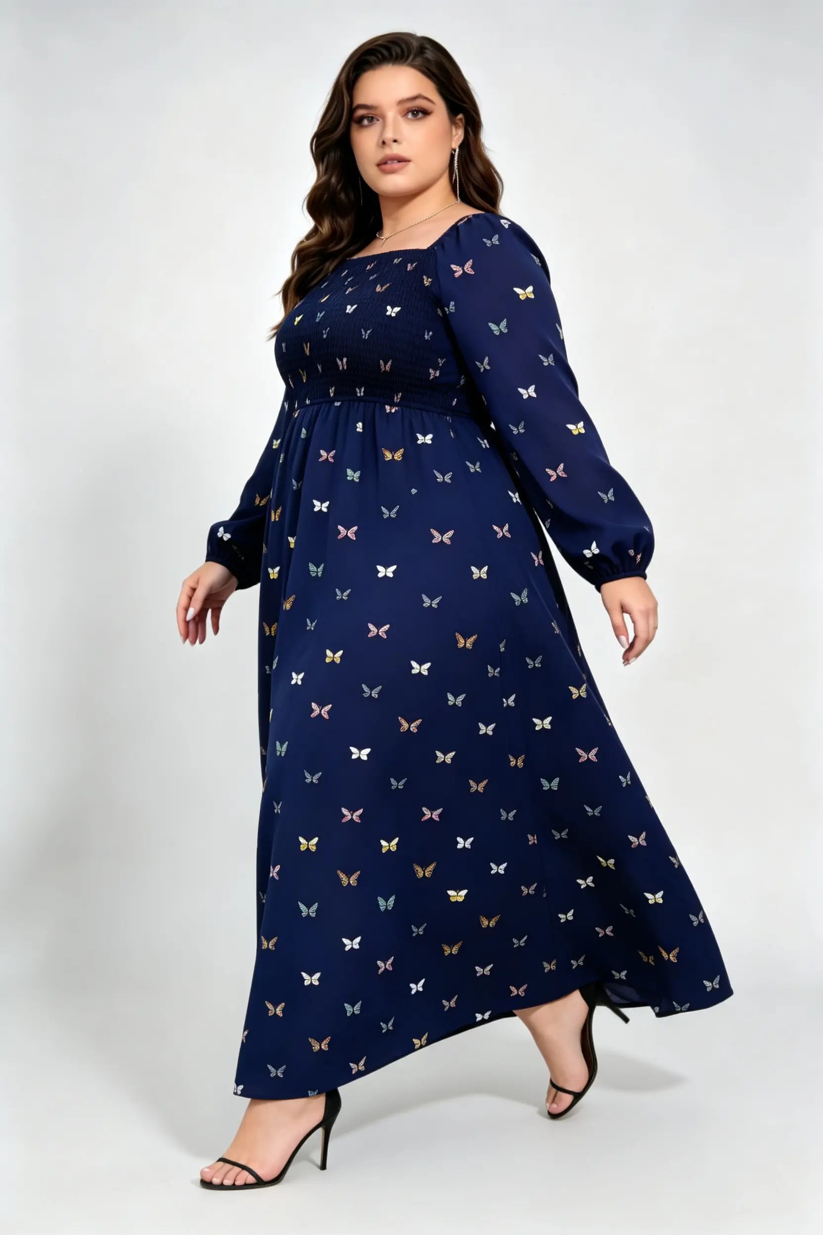 Curvy model wearing plus size navy blue butterfly print maxi dress, square neck smocked long sleeve a-line casual dress