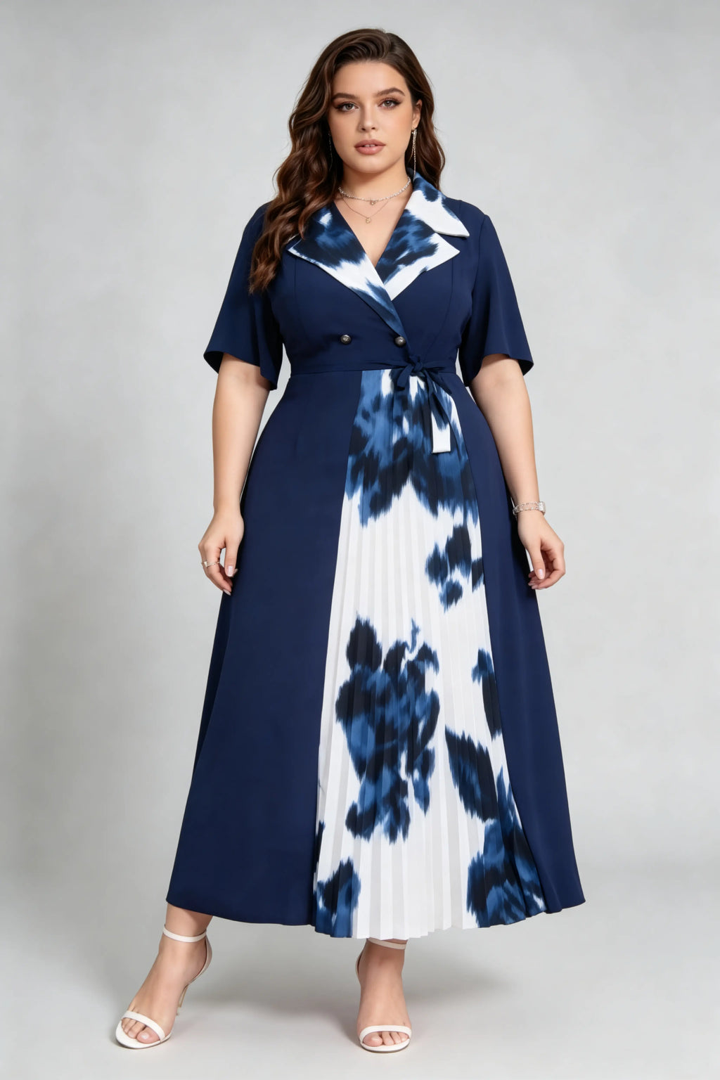 Curvy model wearing plus size navy blue tie-dye pleated midi dress, suit collar short sleeve belted a-line work dress