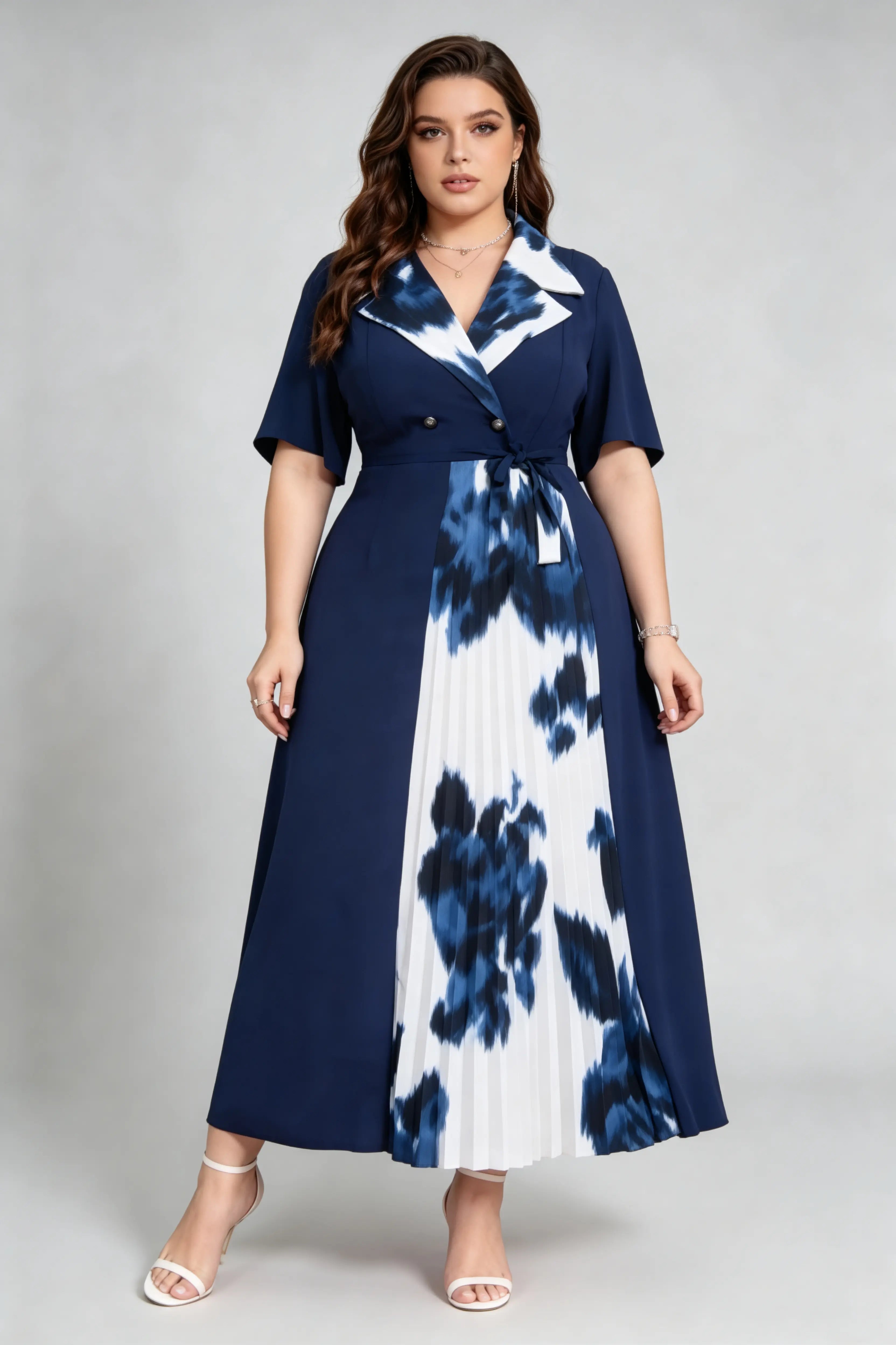 Curvy model wearing plus size navy blue tie-dye pleated midi dress, suit collar short sleeve belted a-line work dress