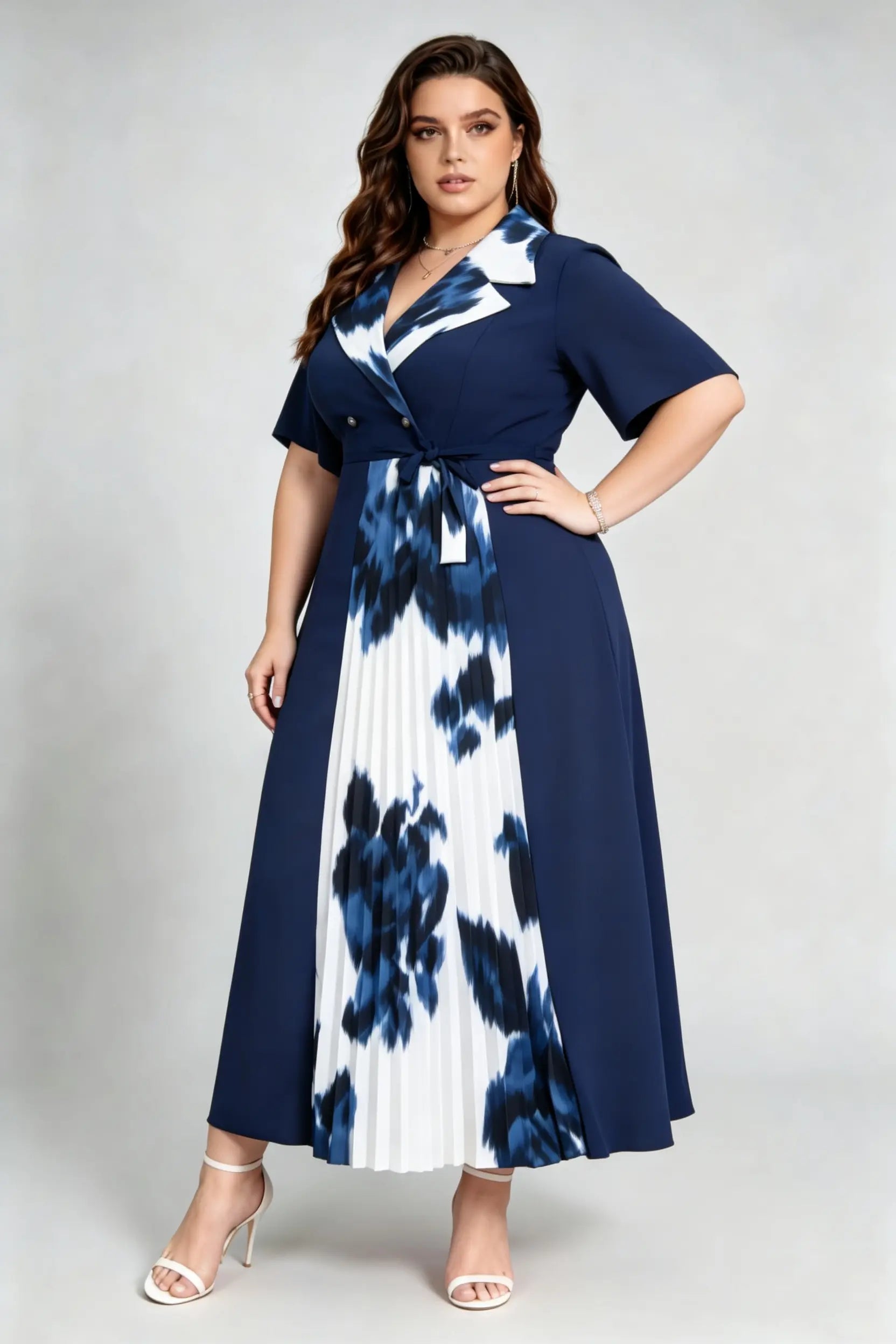 Curvy model wearing plus size navy blue tie-dye pleated midi dress, suit collar short sleeve belted a-line work dress