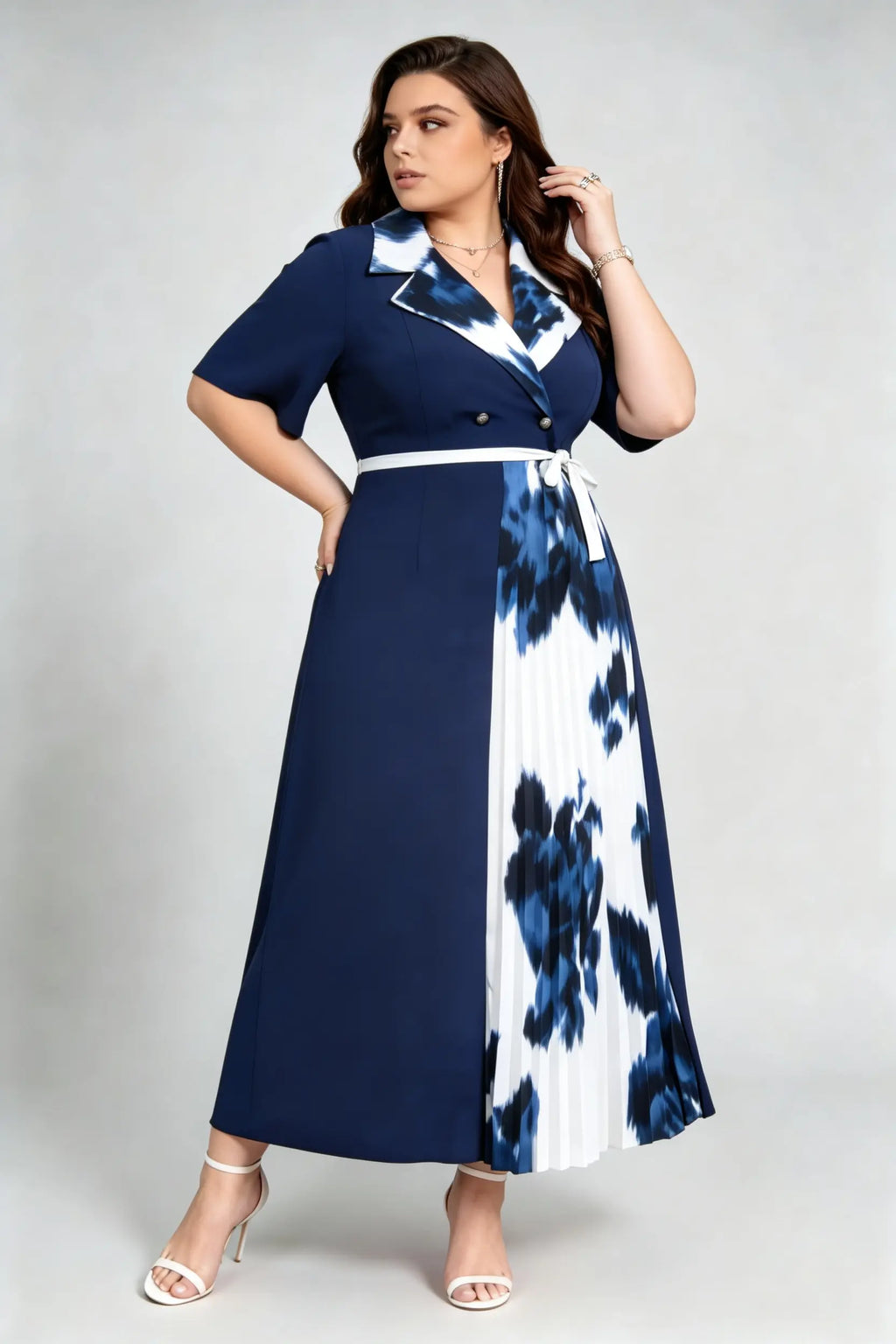 Curvy model wearing plus size navy blue tie-dye pleated midi dress, suit collar short sleeve belted a-line work dress