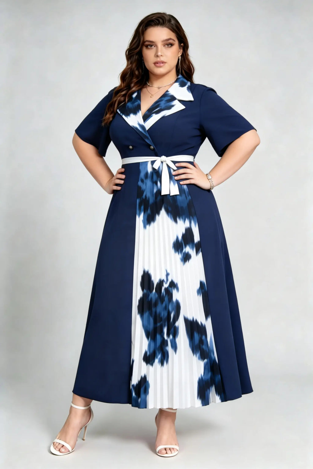 Curvy model wearing plus size navy blue tie-dye pleated midi dress, suit collar short sleeve belted a-line work dress