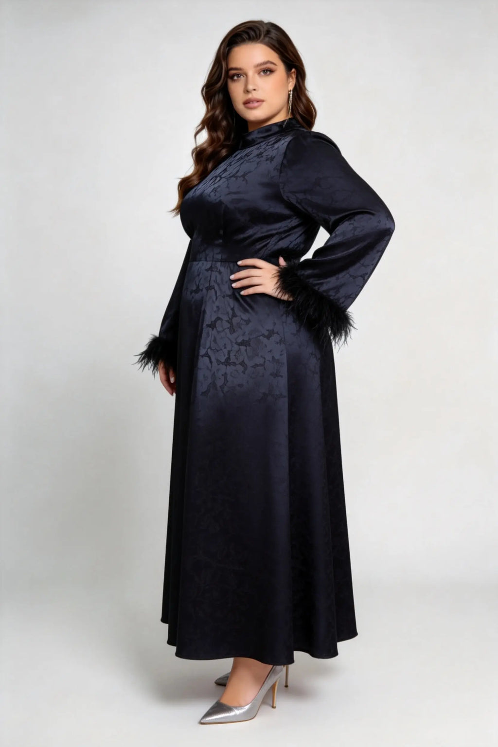 Curvy model wearing plus size black jacquard feather cuff maxi dress, stand collar long sleeve back tie a-line formal dress