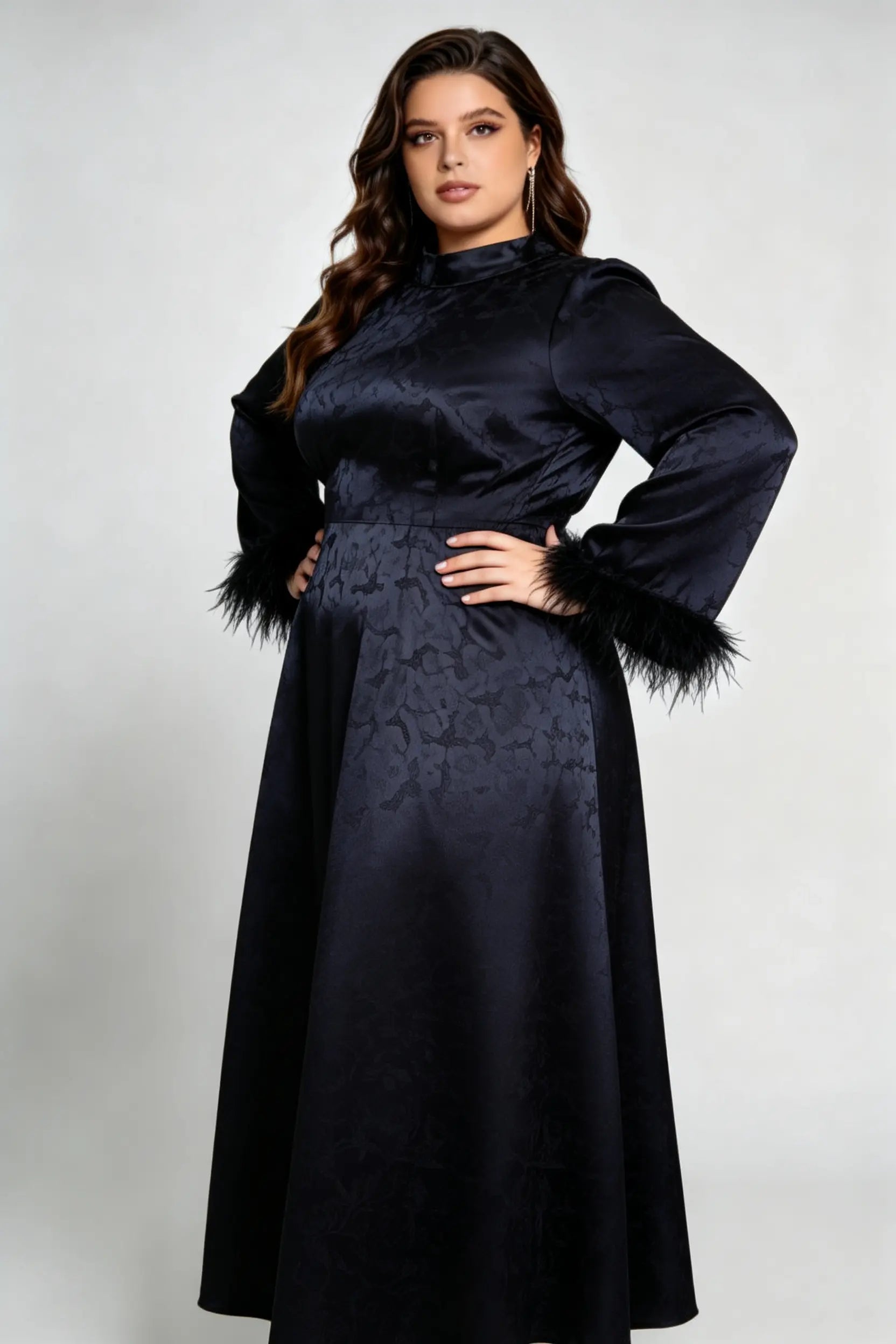 Curvy model wearing plus size black jacquard feather cuff maxi dress, stand collar long sleeve back tie a-line formal dress
