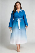 Curvy model wearing plus size blue gradient pleated midi dress, lapel collar wrap v-neck long sleeve belted a-line work dress