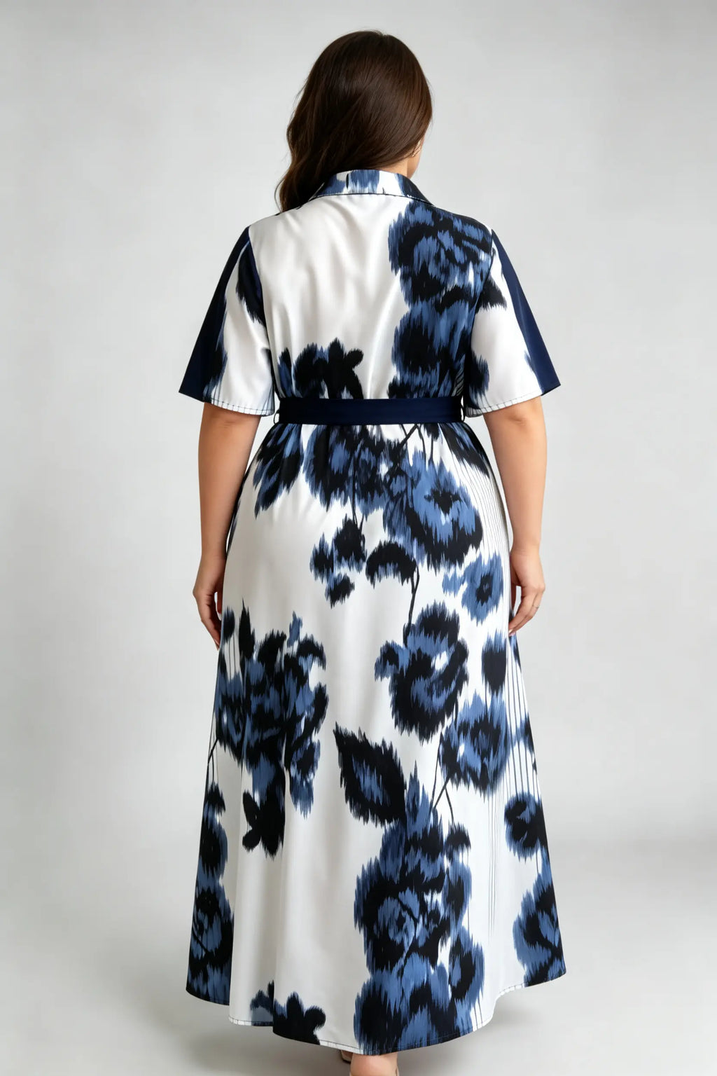 Curvy model wearing plus size blue navy & white floral shirt maxi dress, collared short sleeve self-tie belted a-line dress