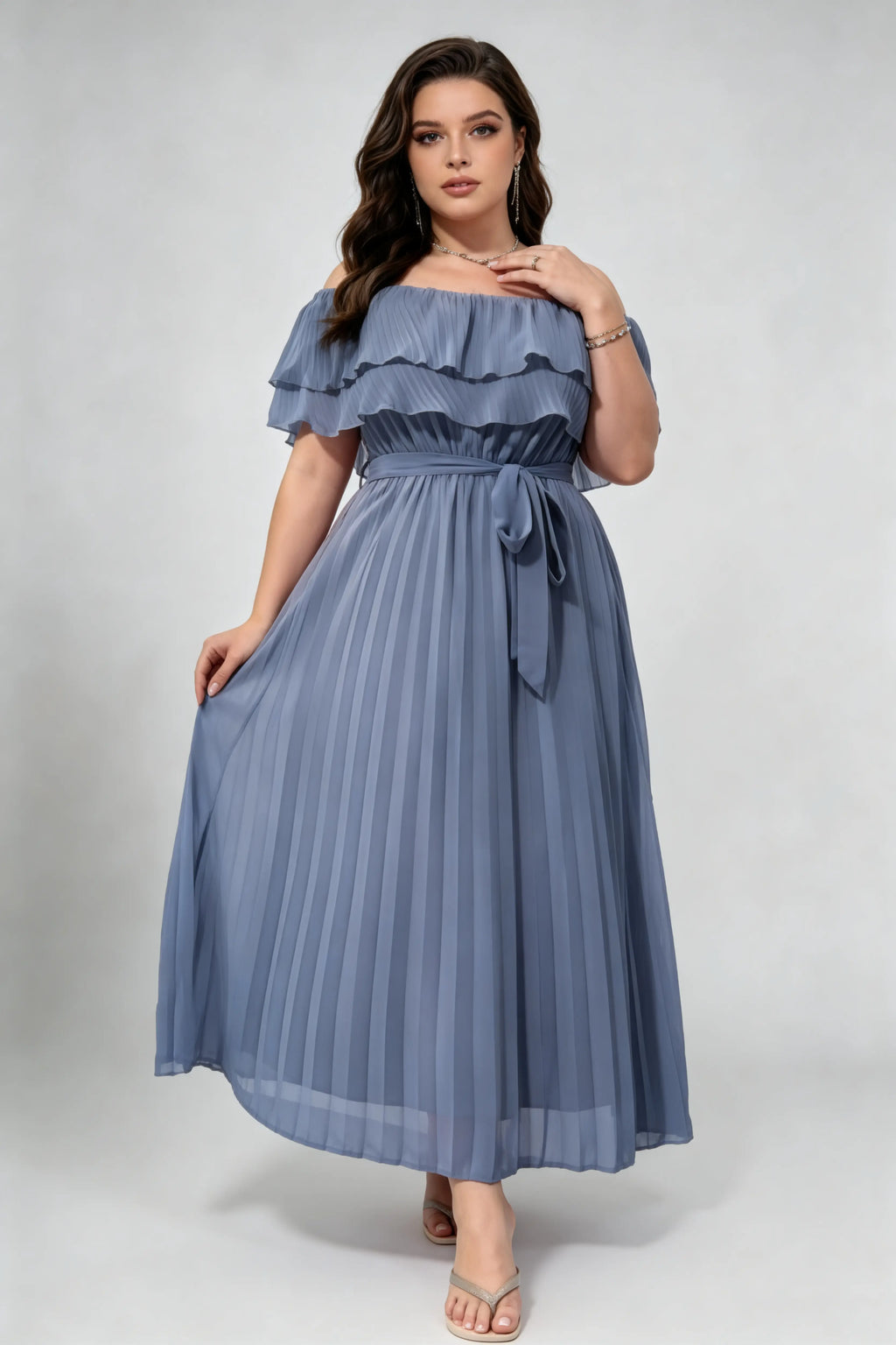 Curvy model wearing plus size dusty blue off-shoulder pleated maxi dress, layered ruffle self-tie belted a-line formal dress