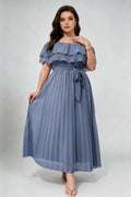 Curvy model wearing plus size dusty blue off-shoulder pleated maxi dress, layered ruffle self-tie belted a-line formal dress