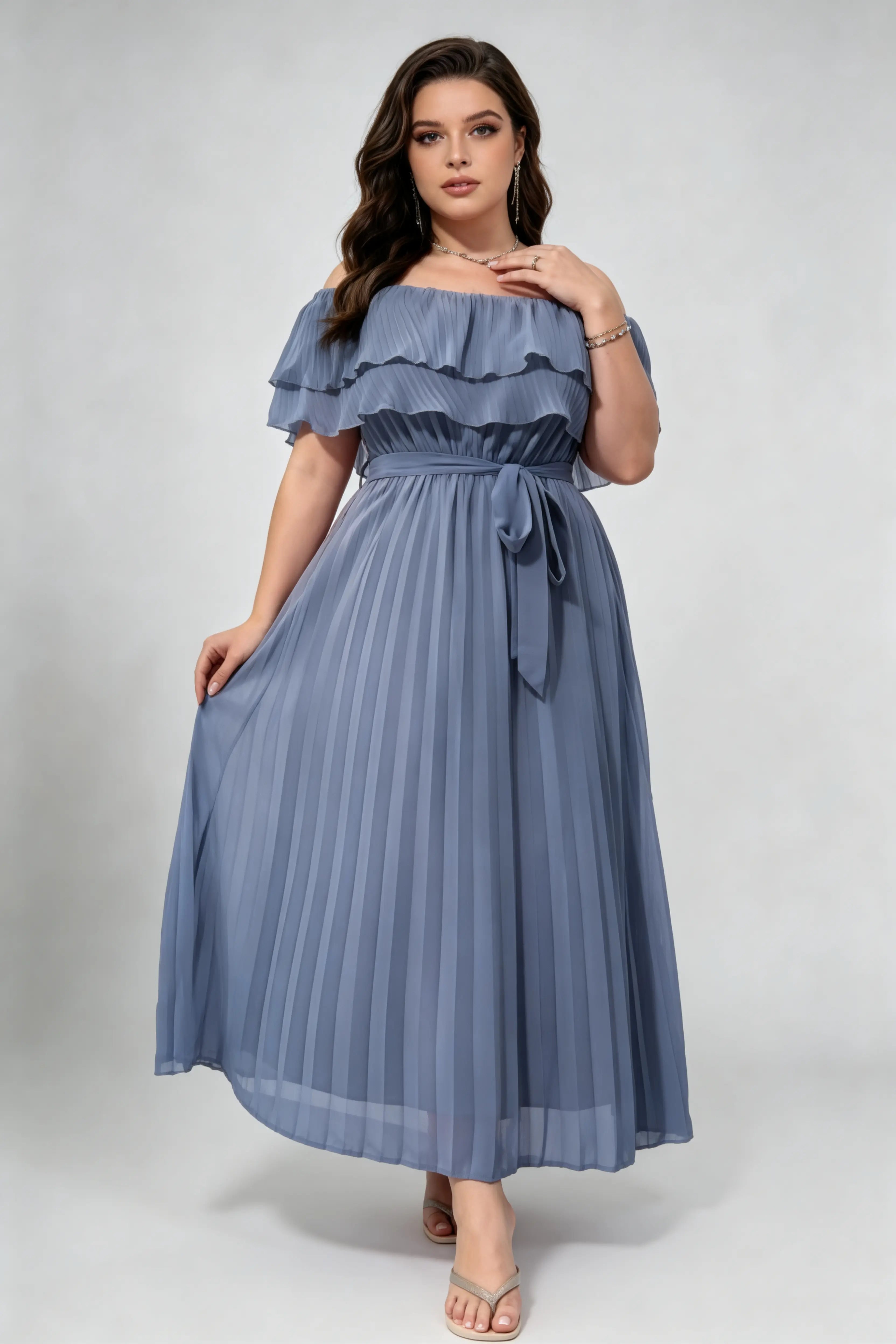 Curvy model wearing plus size dusty blue off-shoulder pleated maxi dress, layered ruffle self-tie belted a-line formal dress