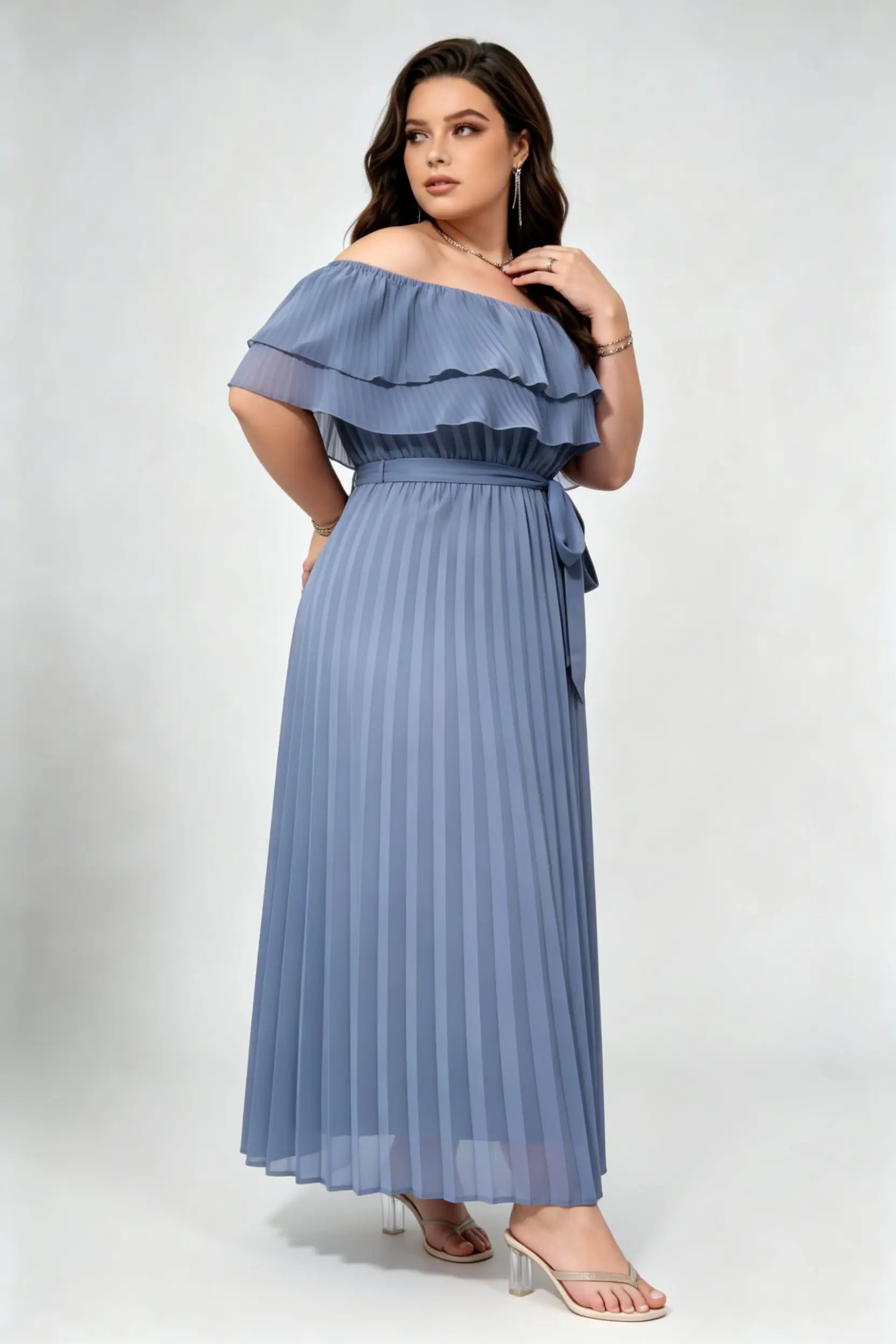 Curvy model wearing plus size dusty blue off-shoulder pleated maxi dress, layered ruffle self-tie belted a-line formal dress