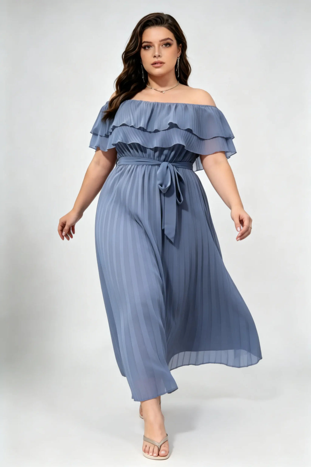 Curvy model wearing plus size dusty blue off-shoulder pleated maxi dress, layered ruffle self-tie belted a-line formal dress