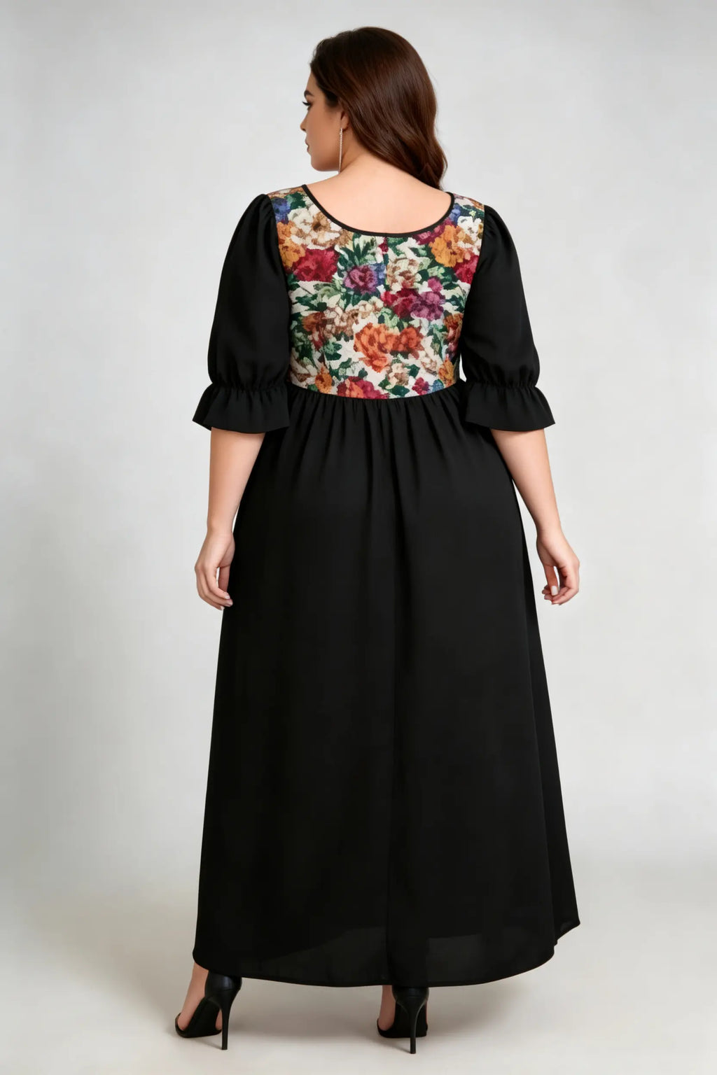 Curvy model wearing plus size floral print square neck maxi dress, black a-line with puffed sleeves, elegant summer dress