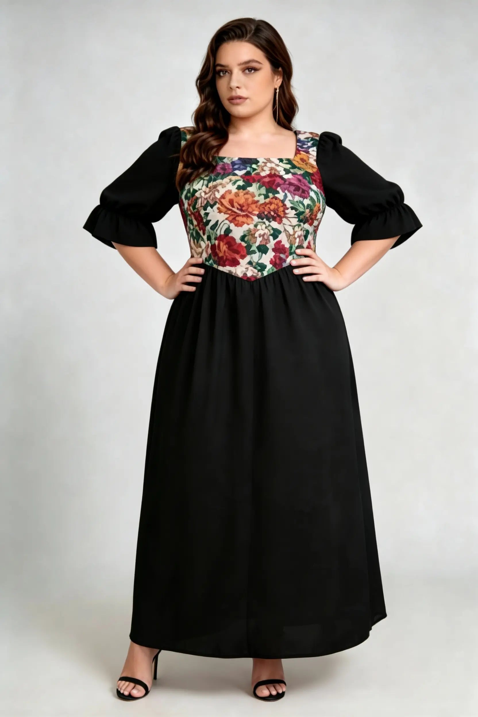Curvy model wearing plus size floral print square neck maxi dress, black a-line with puffed sleeves, elegant summer dress