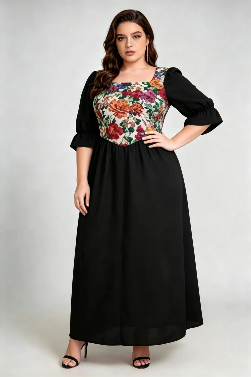 Curvy model wearing plus size floral print square neck maxi dress, black a-line with puffed sleeves, elegant summer dress