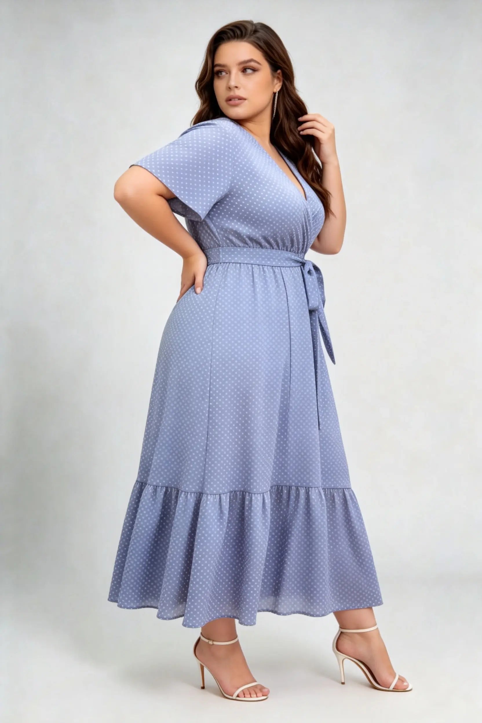 Curvy model wearing plus size blue polka dot wrap maxi dress, v-neck flutter sleeve a-line with belt, elegant summer dress