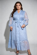 Curvy model wearing plus size light blue floral jacquard shirt maxi dress, long sleeve button-down with waist tie, elegant summer dress