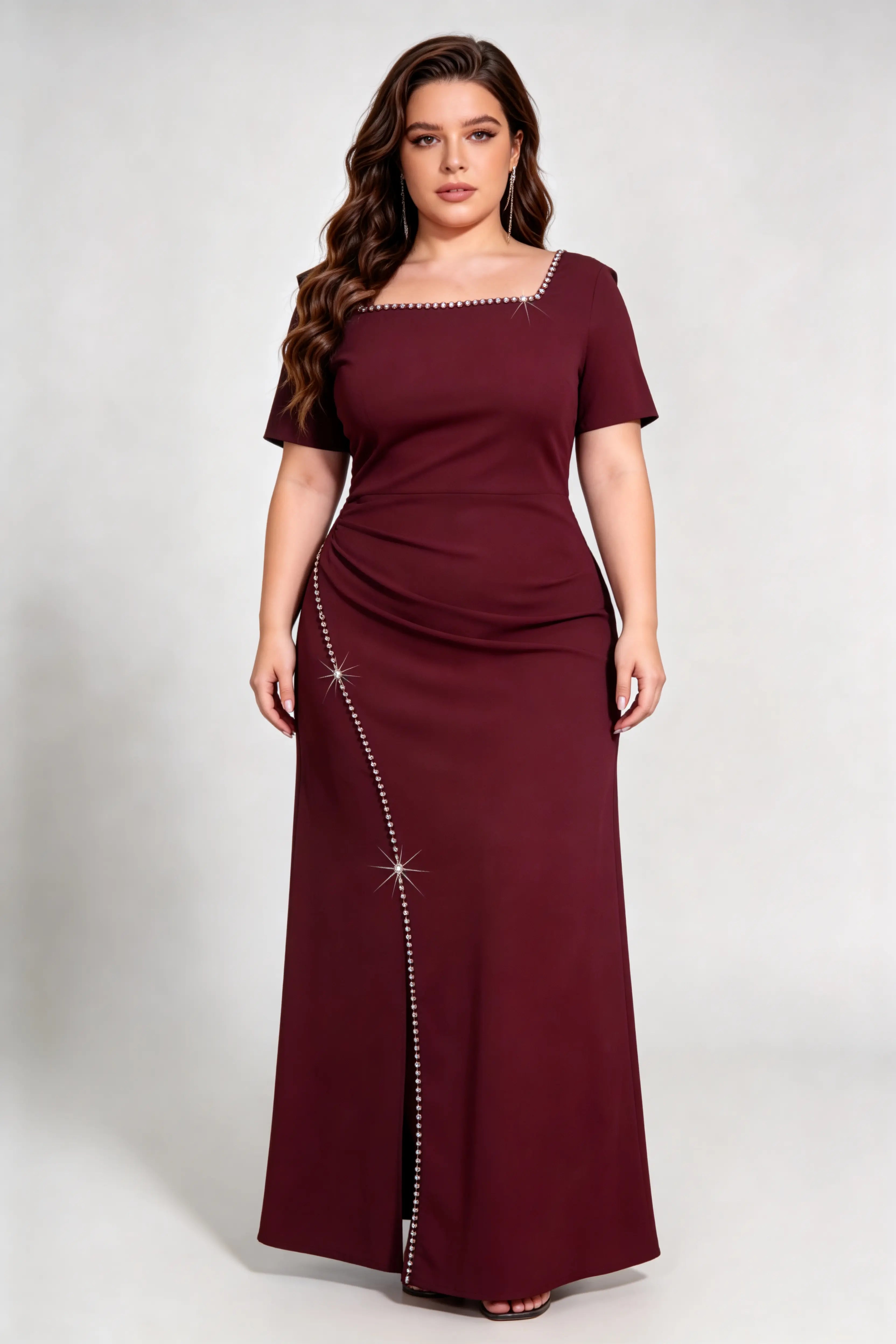 Curvy model wearing plus size rose-red burgundy rhinestone trim evening gown, square neck/off-shoulder mermaid maxi dress with slit