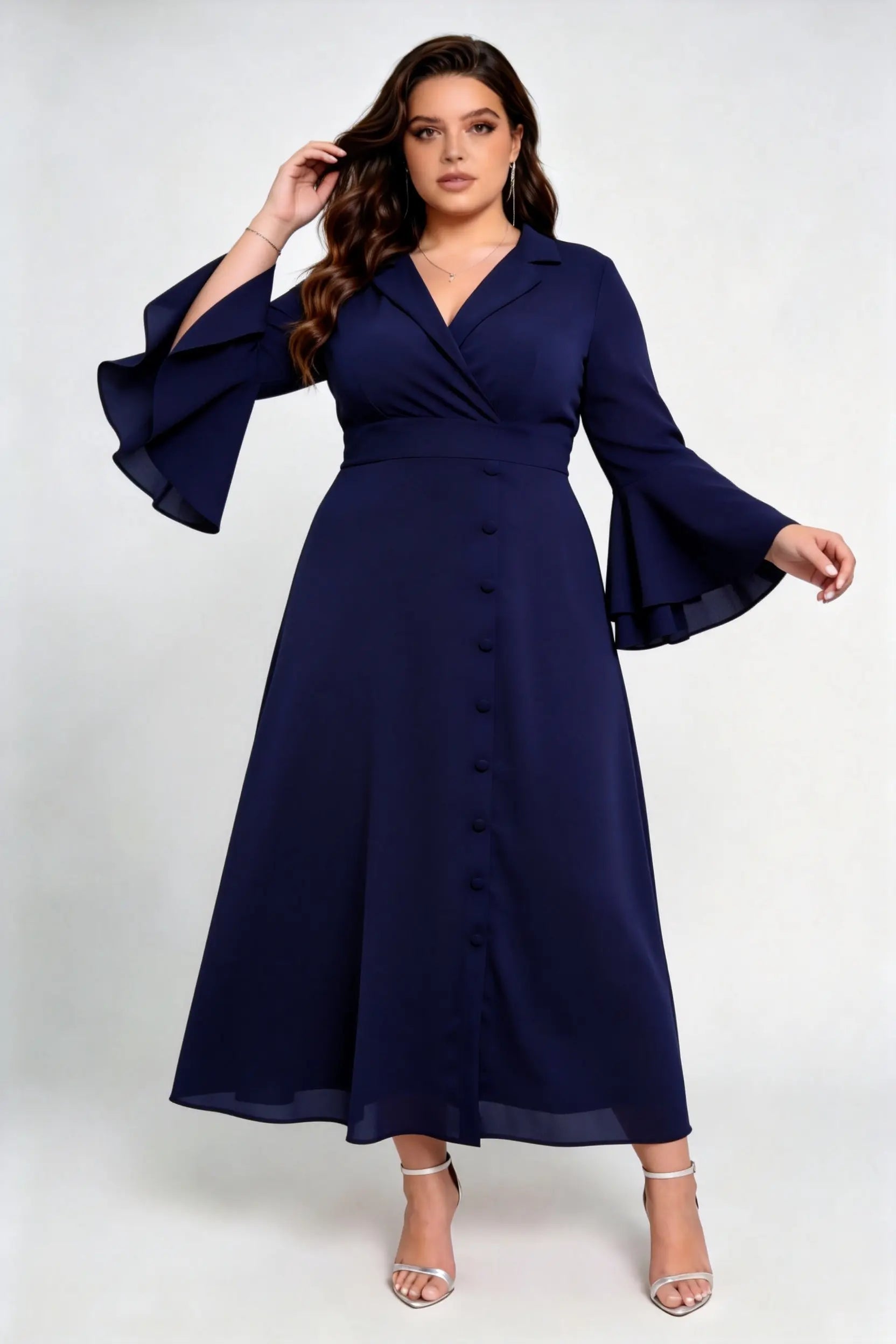 Curvy model wearing plus size navy blue wrap midi dress, notched lapel blazer style with flounce sleeves and waist tie