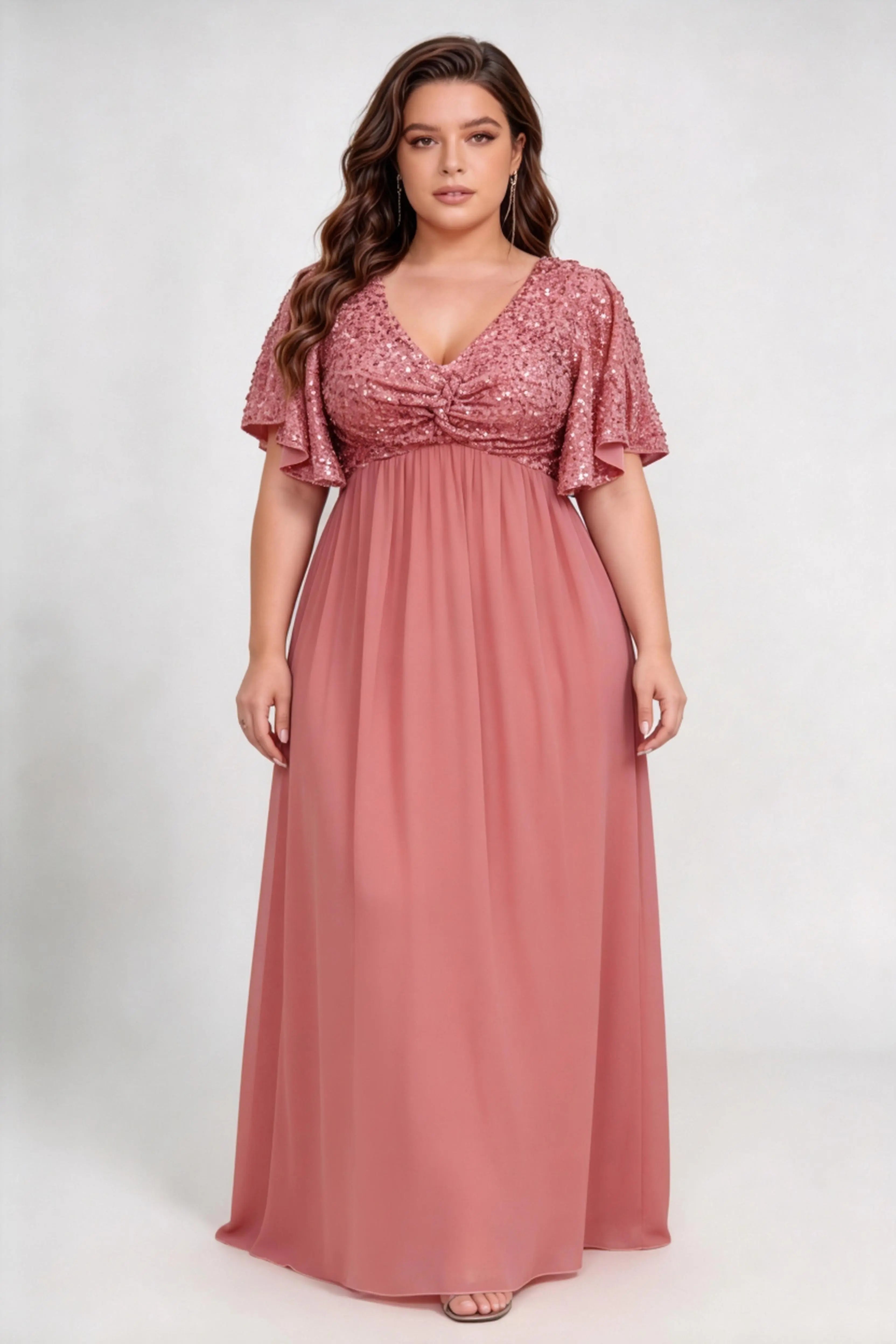 Curvy model wearing plus size pink sequin bodice flutter short sleeve chiffon maxi bridesmaid formal evening dress